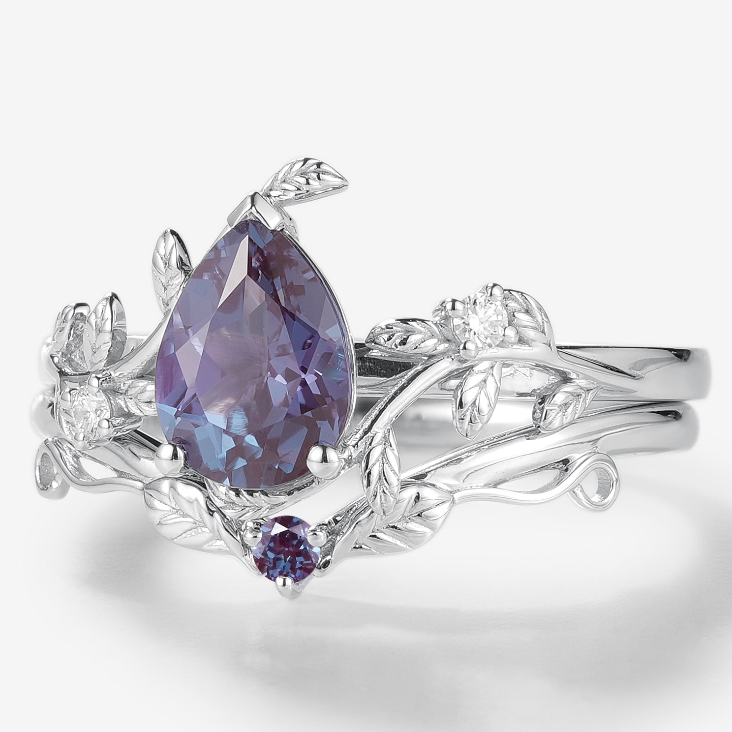 Pear Cut Alexandrite Wedding Ring Set, leaf design with moissanite accents, vintage style, white gold.