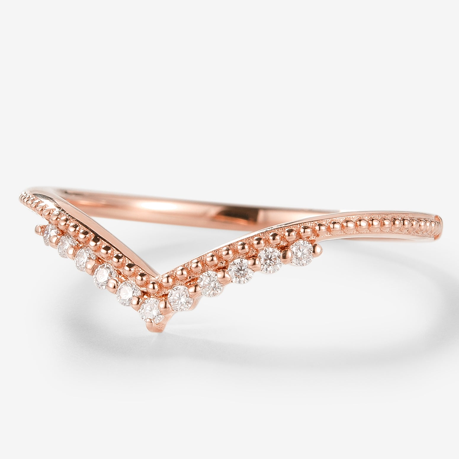 Rose gold moissanite wedding band with milgrain detail. A delicate V-shaped ring for bridal set.