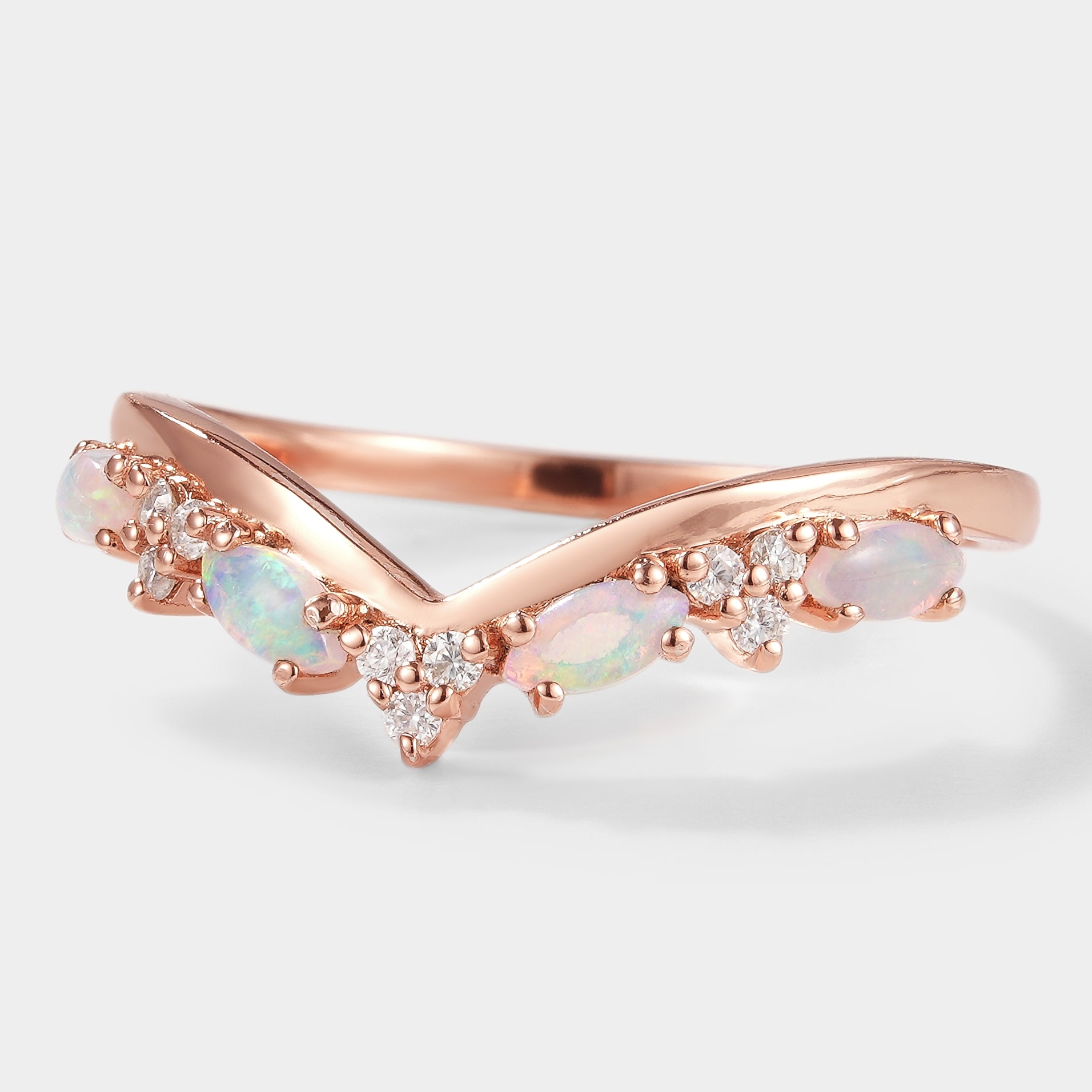 Rose gold opal chevron wedding band featuring moissanite accents, perfect for a bridal set or stackable ring.