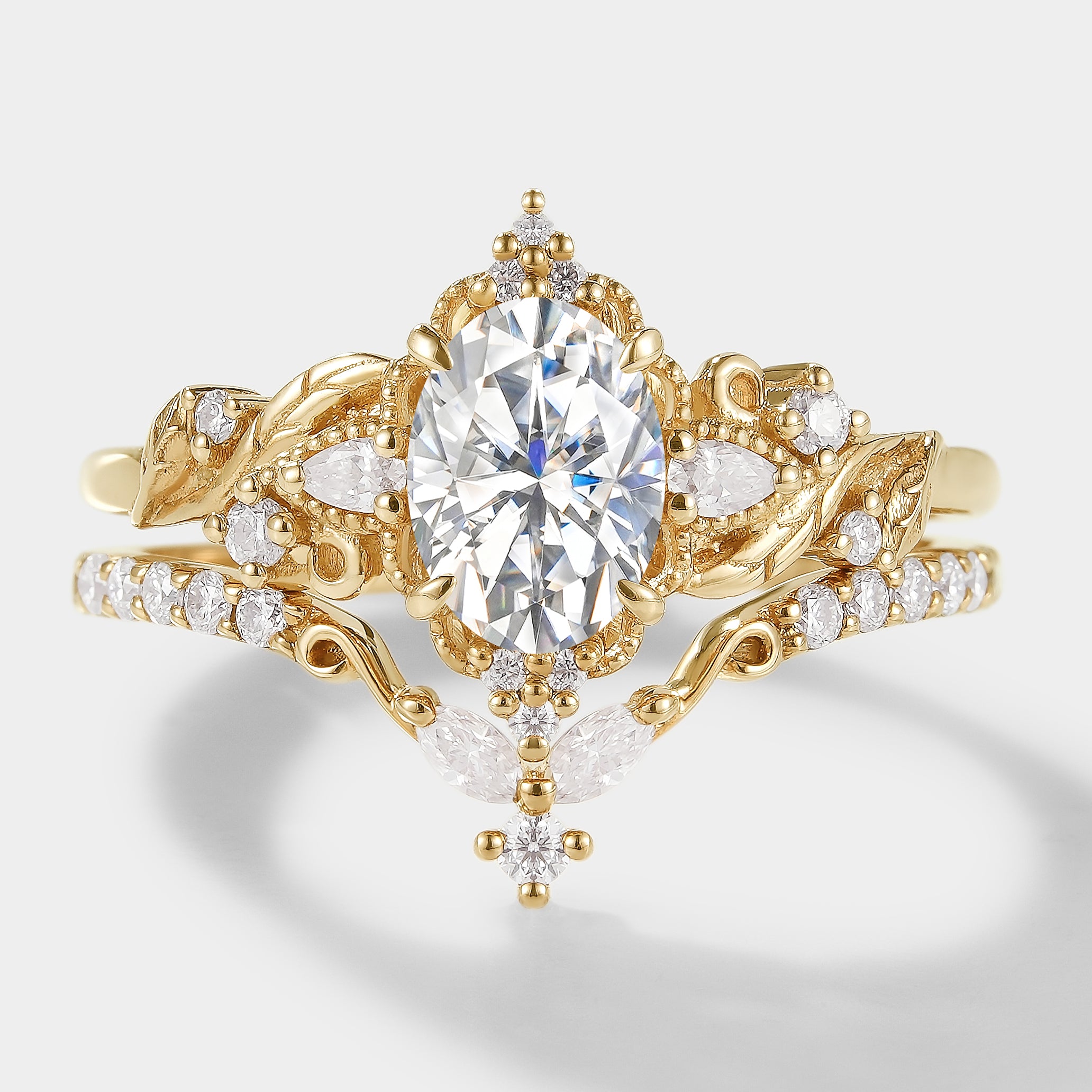 Elongated Leaf Oval Cut Moissanite Ring Set, Leaf-inspired design, gold, bridal set, wedding rings.