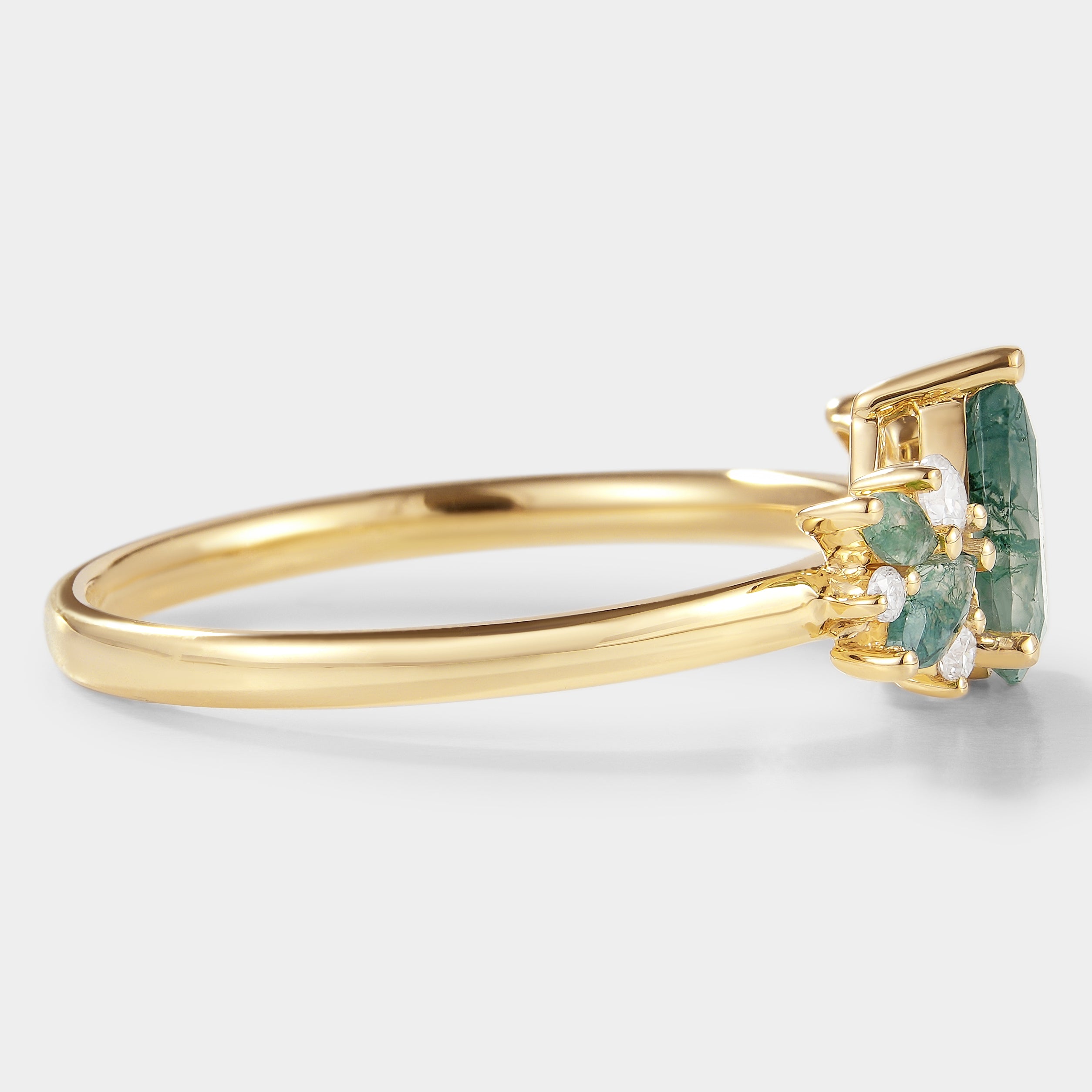 Teardrop moss agate engagement ring in yellow gold with moissanite accents, vintage style.