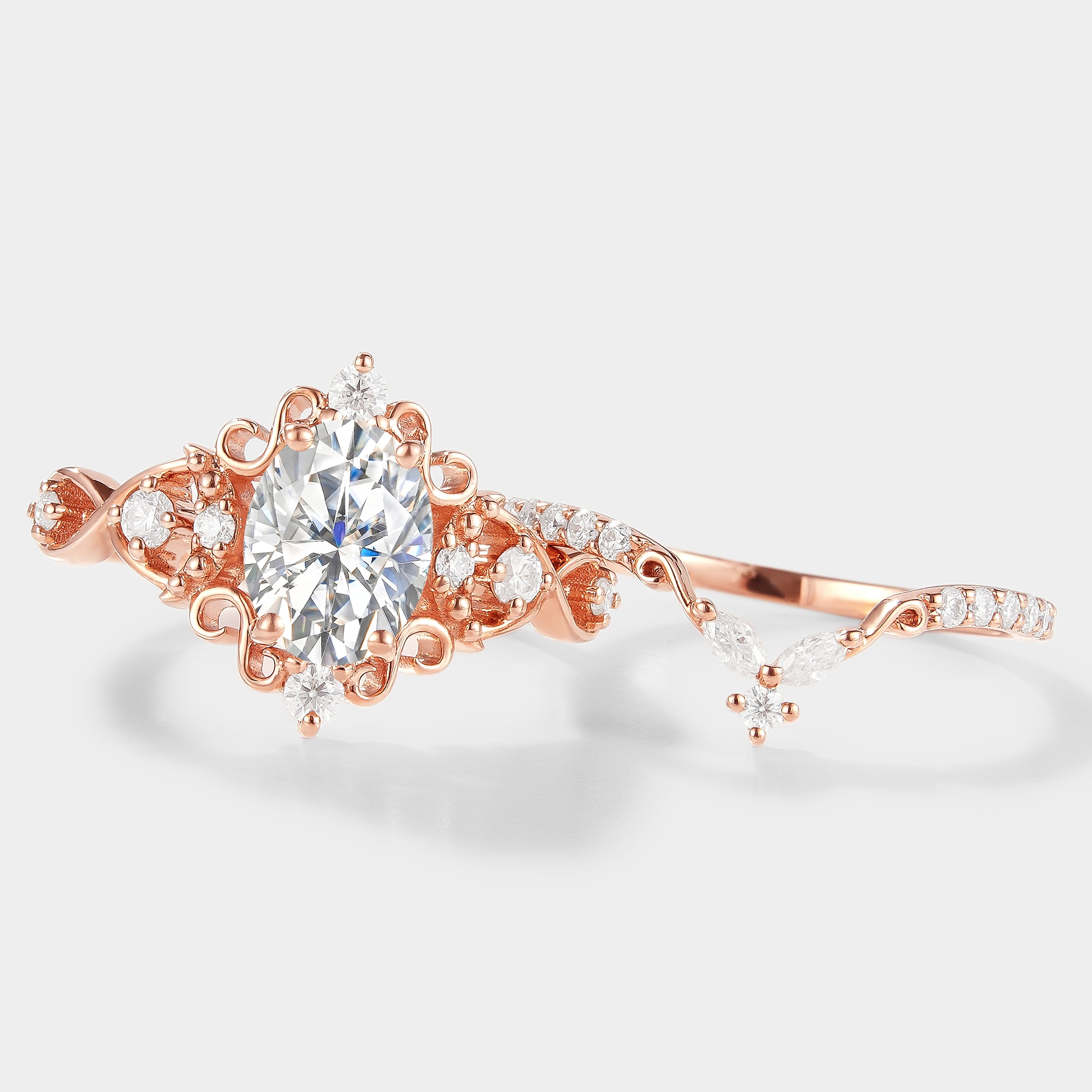 Rose gold vintage moissanite engagement ring set with oval cut center stone and moissanite wedding band, bridal set