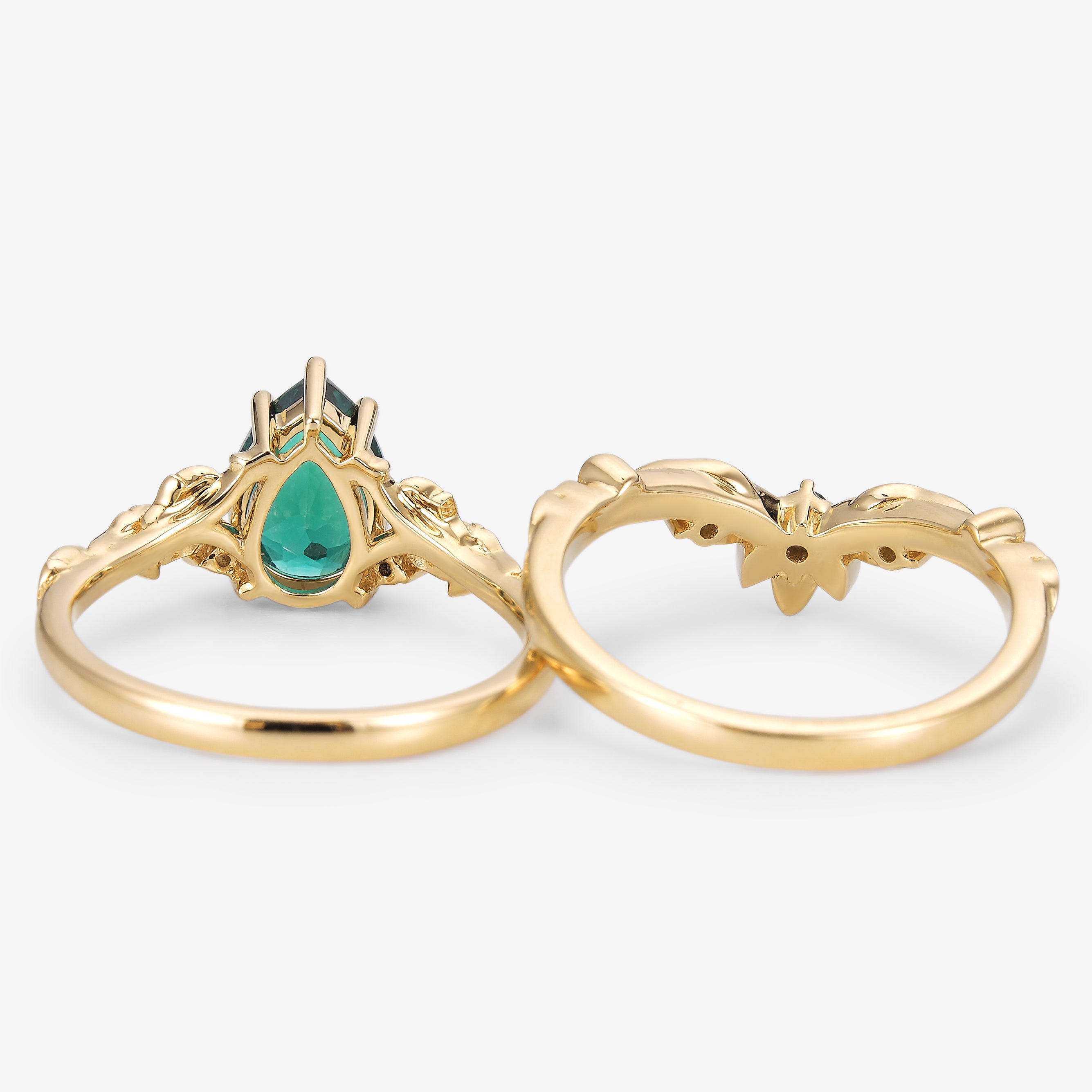 Solid gold pear cut emerald leaf bridal set with moss agate wedding band