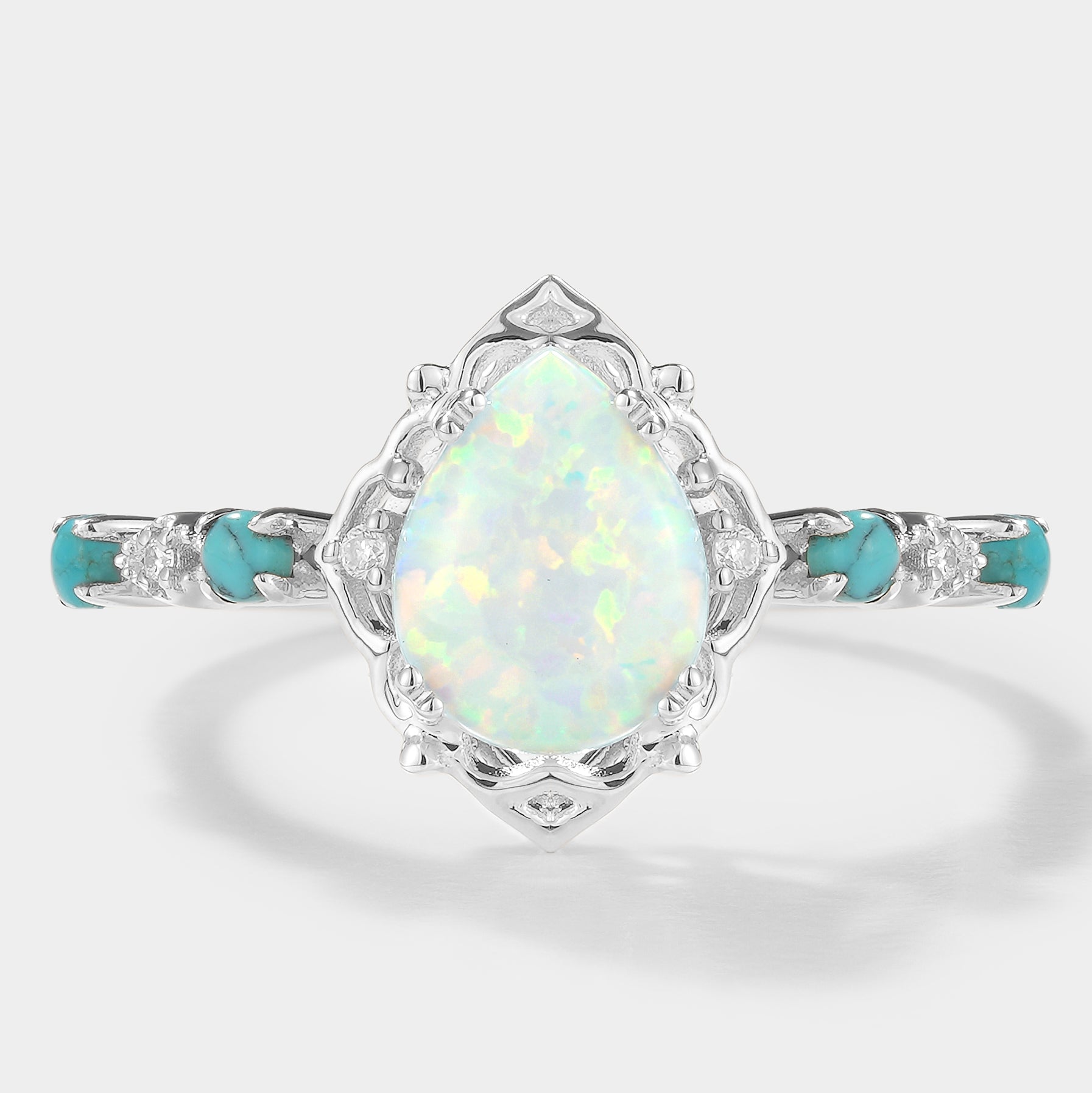 Elegant pear cut opal engagement ring with turquoise stones