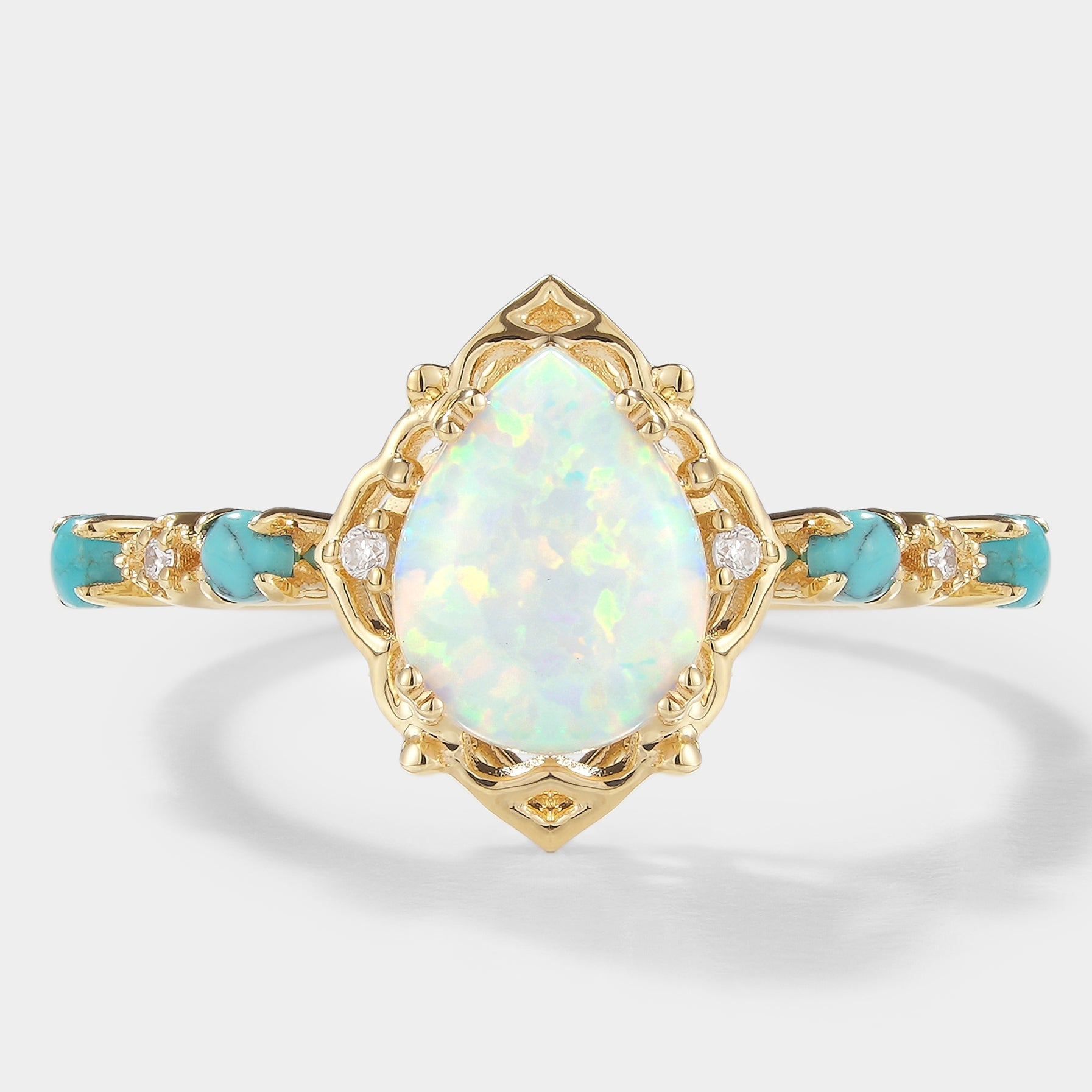 Pear-cut opal engagement ring with turquoise stones