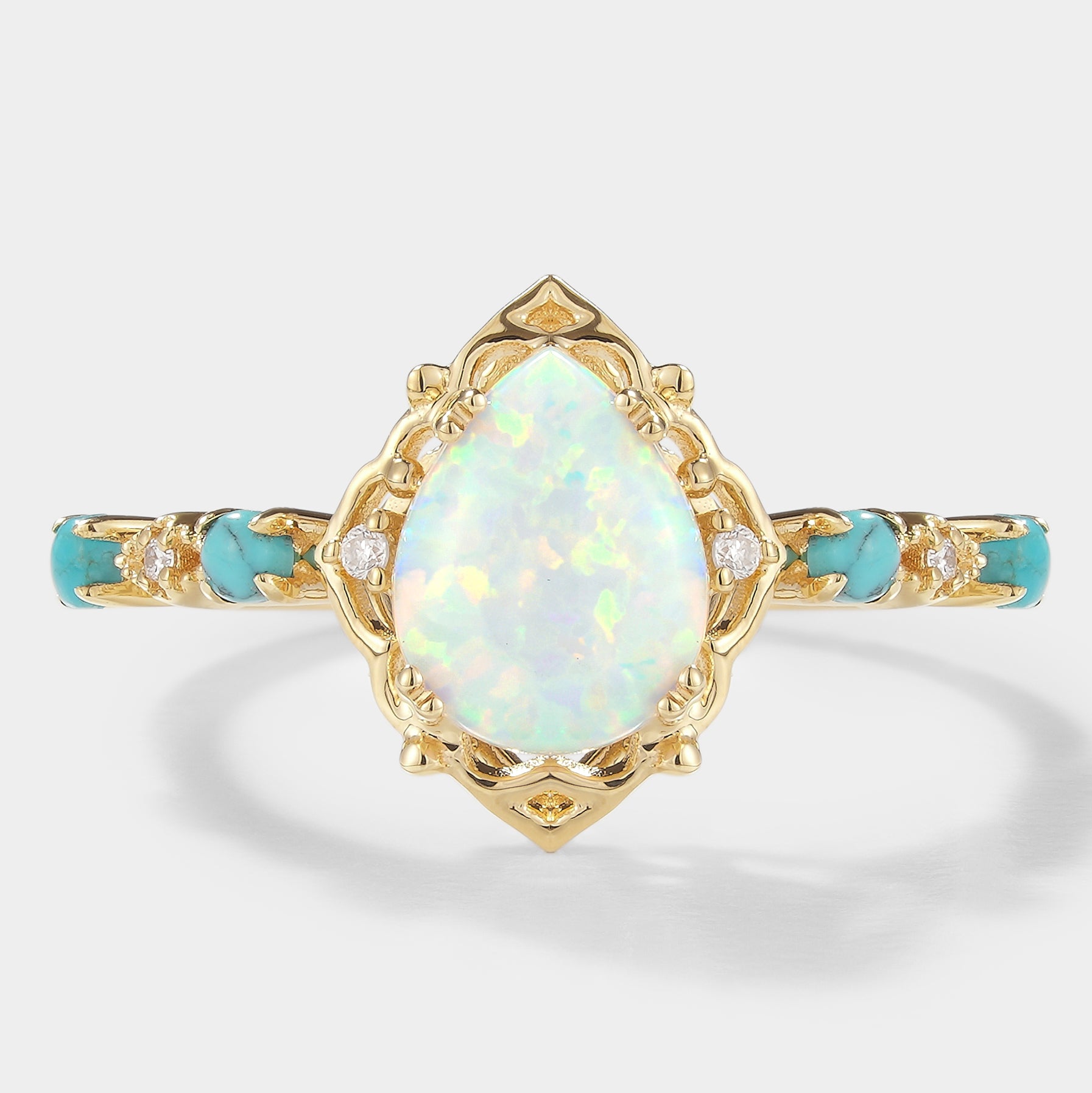 Pear-cut opal engagement ring with turquoise stones