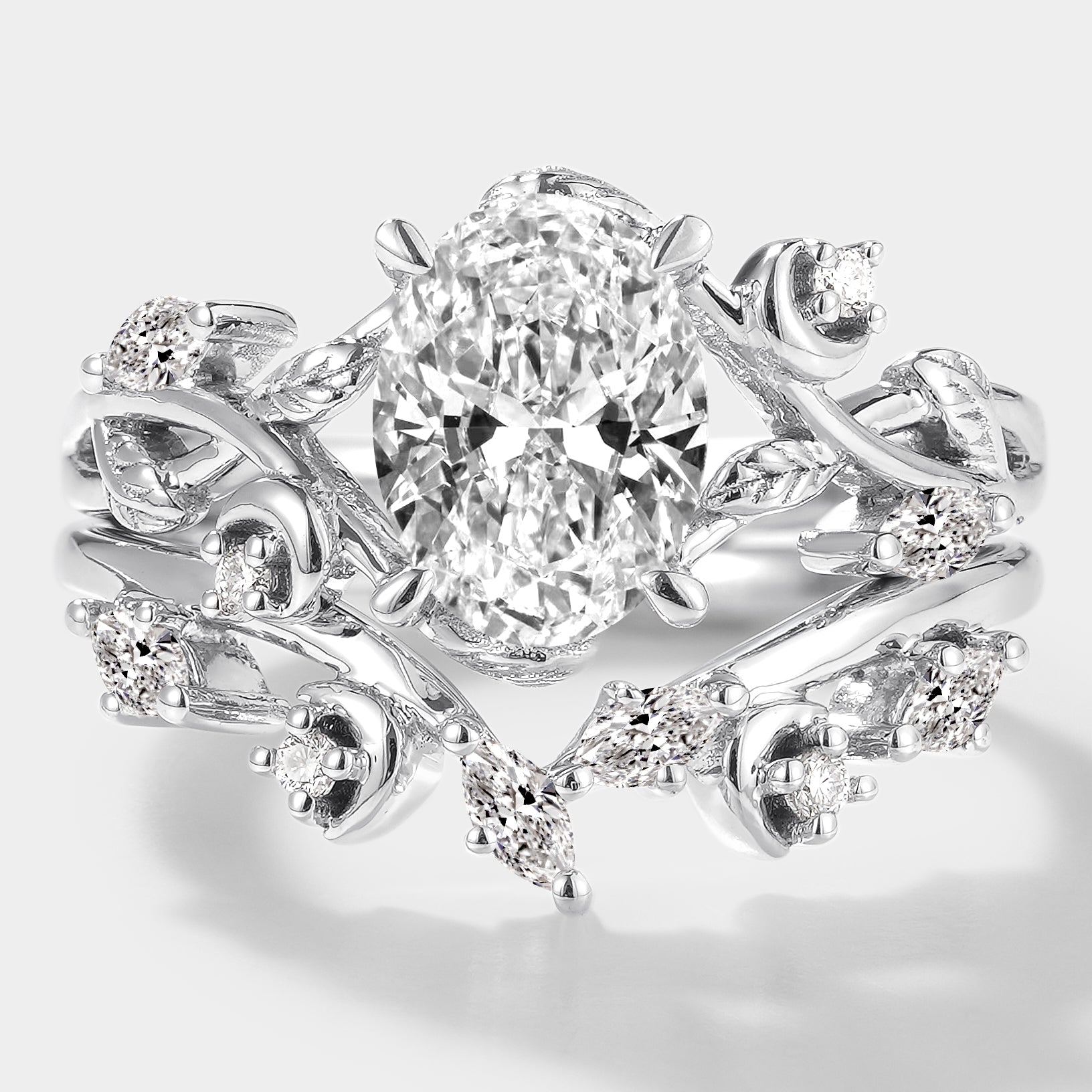 Oval lab grown diamond engagement ring with a curved moissanite wedding band