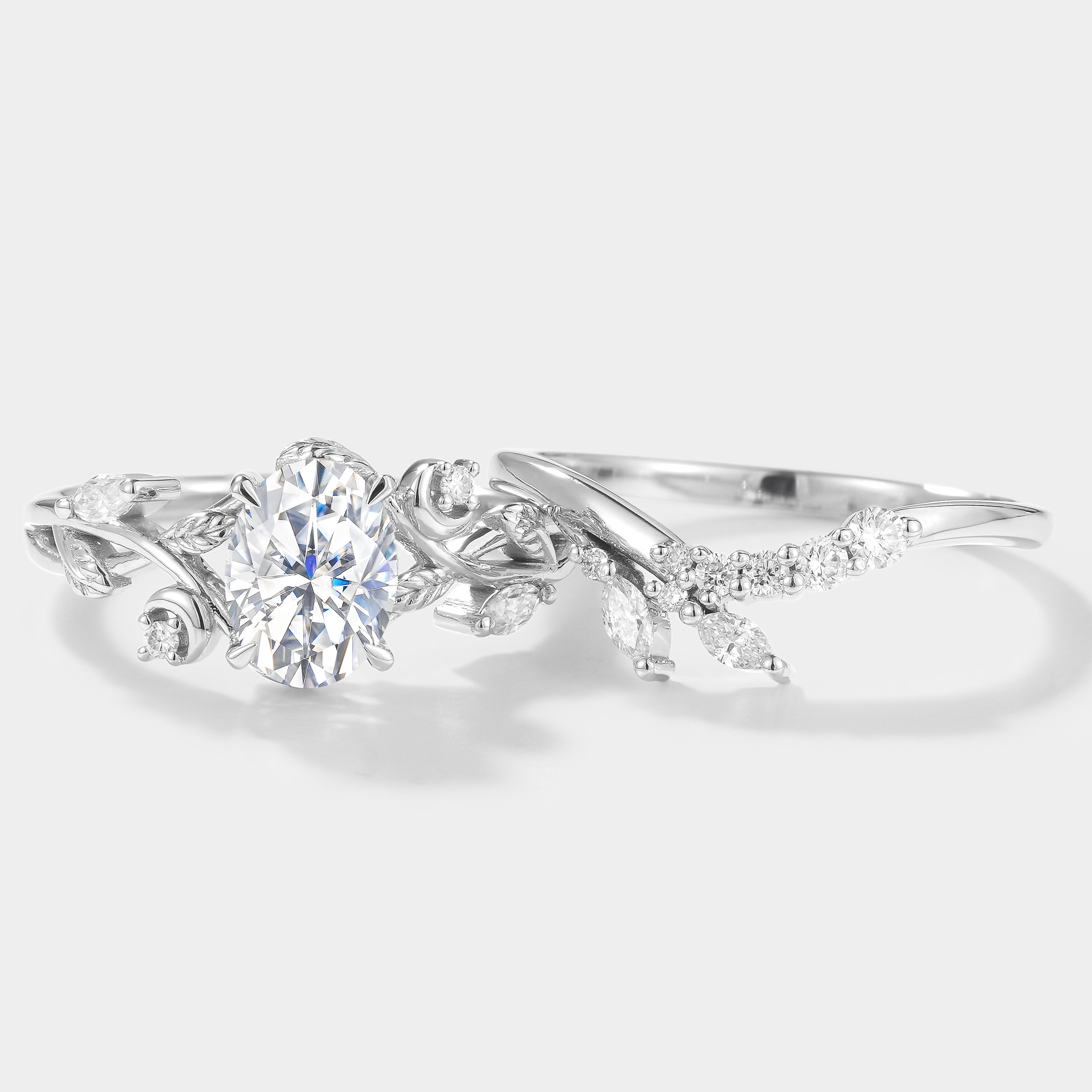 Oval moissanite engagement ring set with leaf and moon design