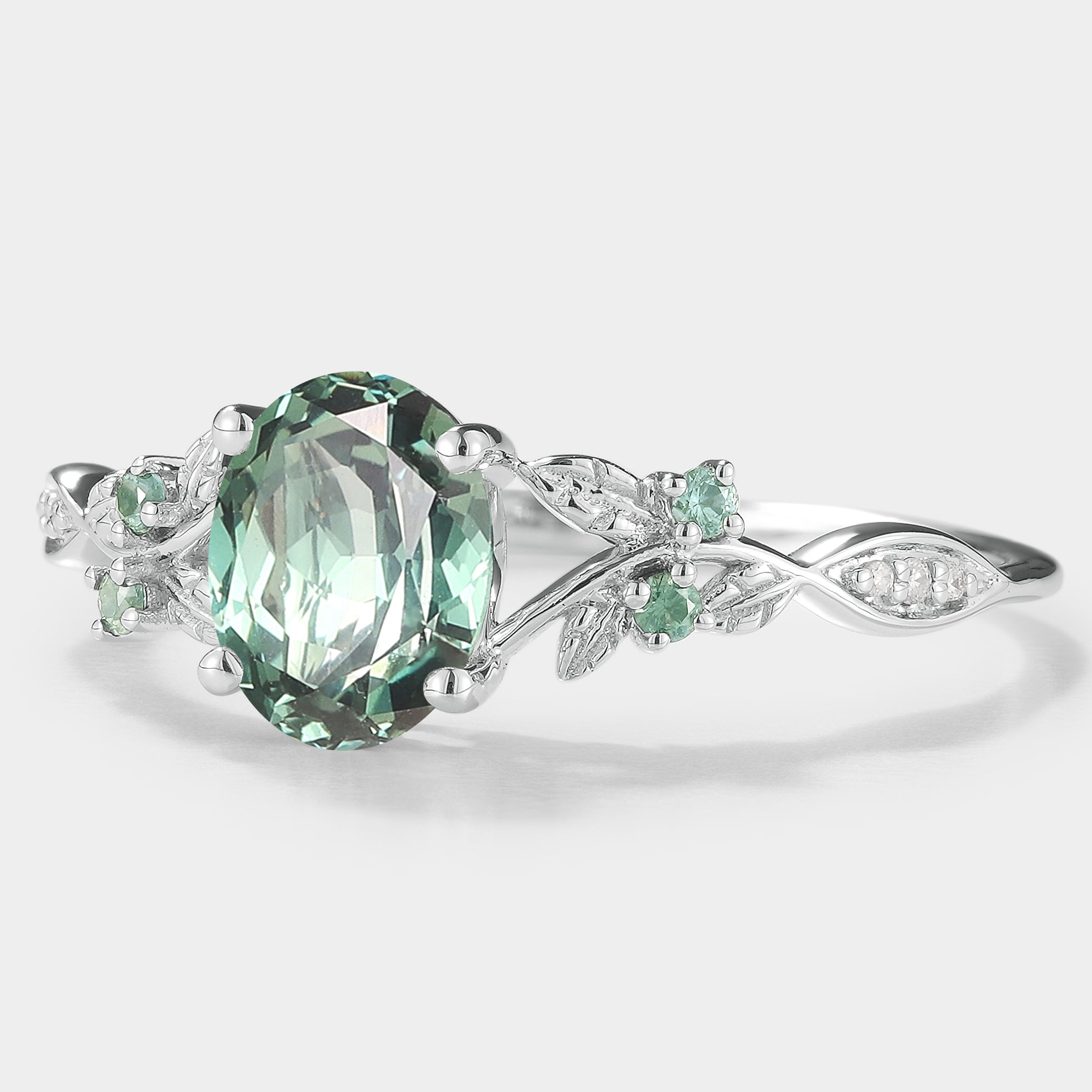 Nature-inspired green sapphire engagement ring with leaf detail