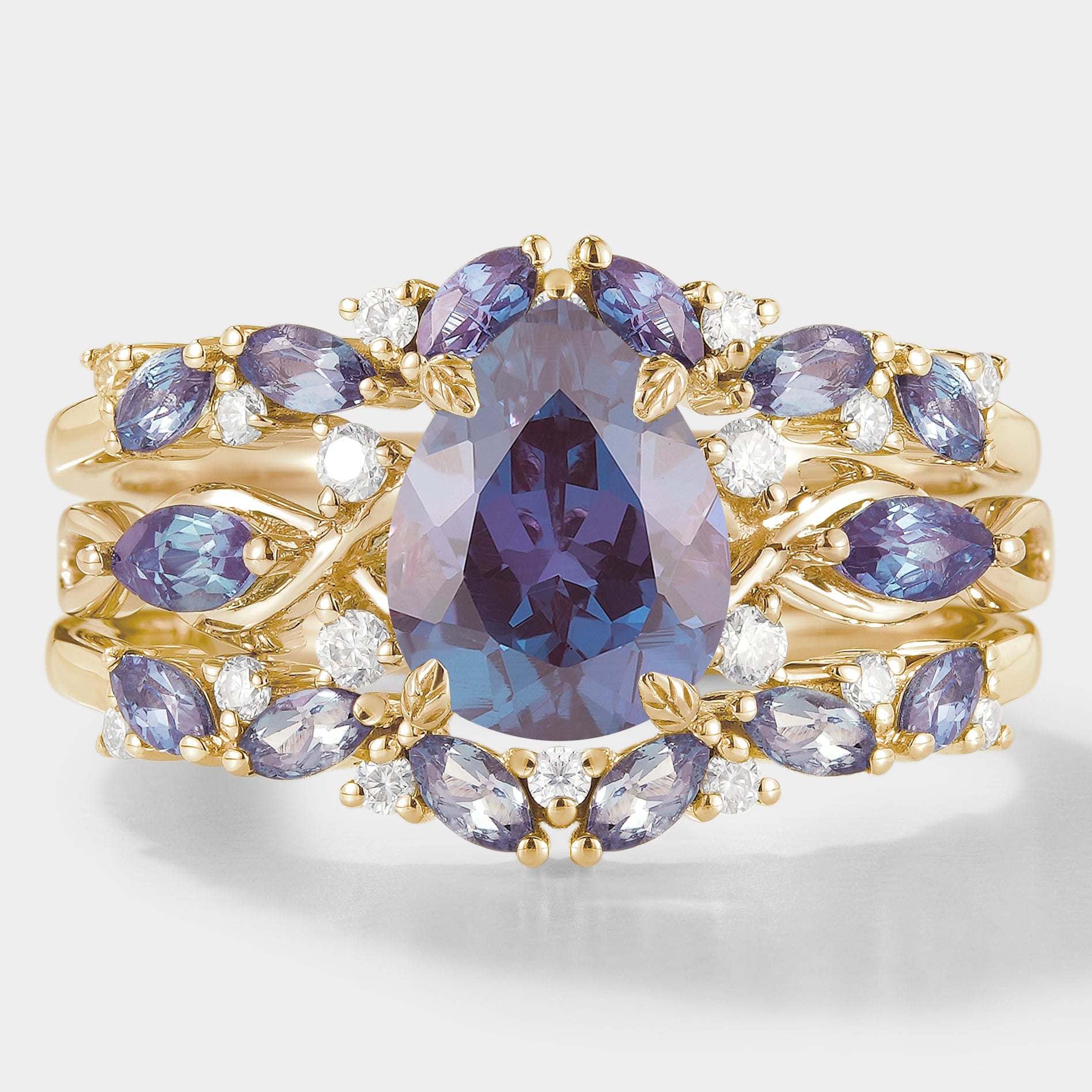 Nature-inspired Alexandrite engagement ring set with enhancer band