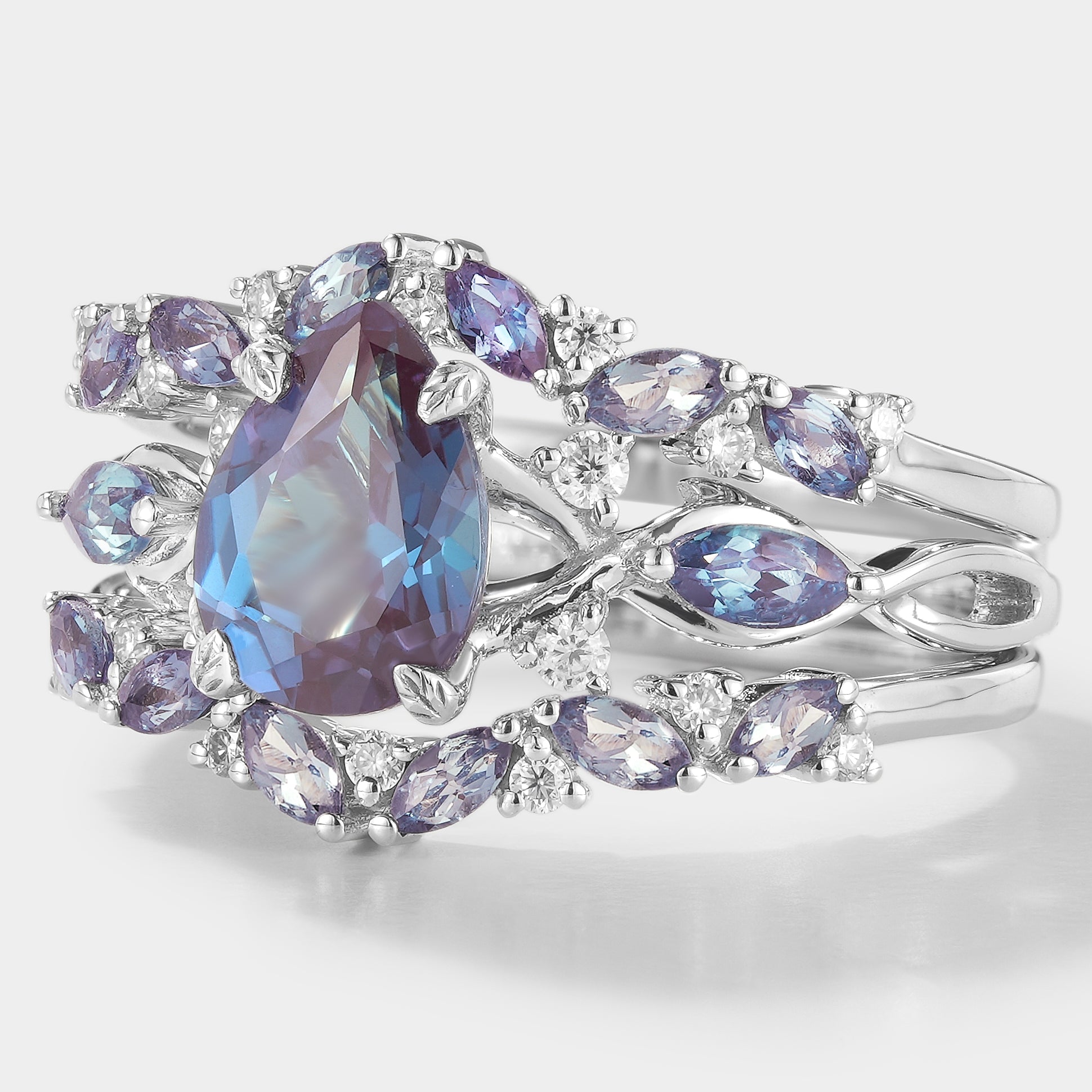 Alexandrite engagement ring set with enhancer band, nature-inspired design
