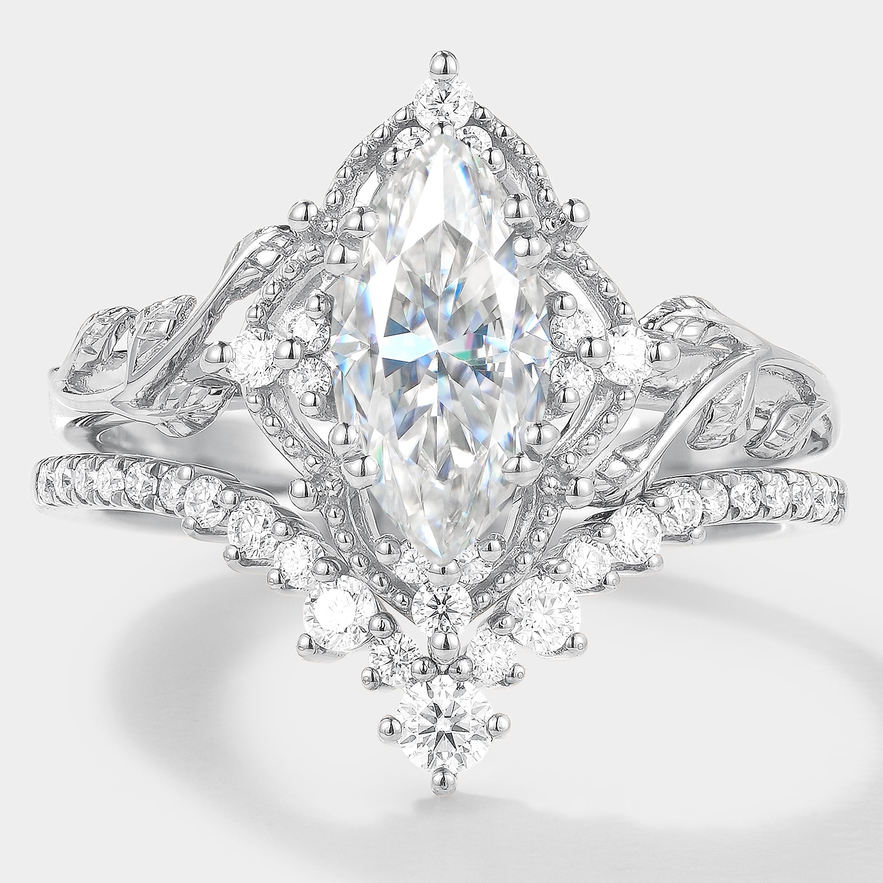 Nature-inspired marquise moissanite engagement ring and wedding band