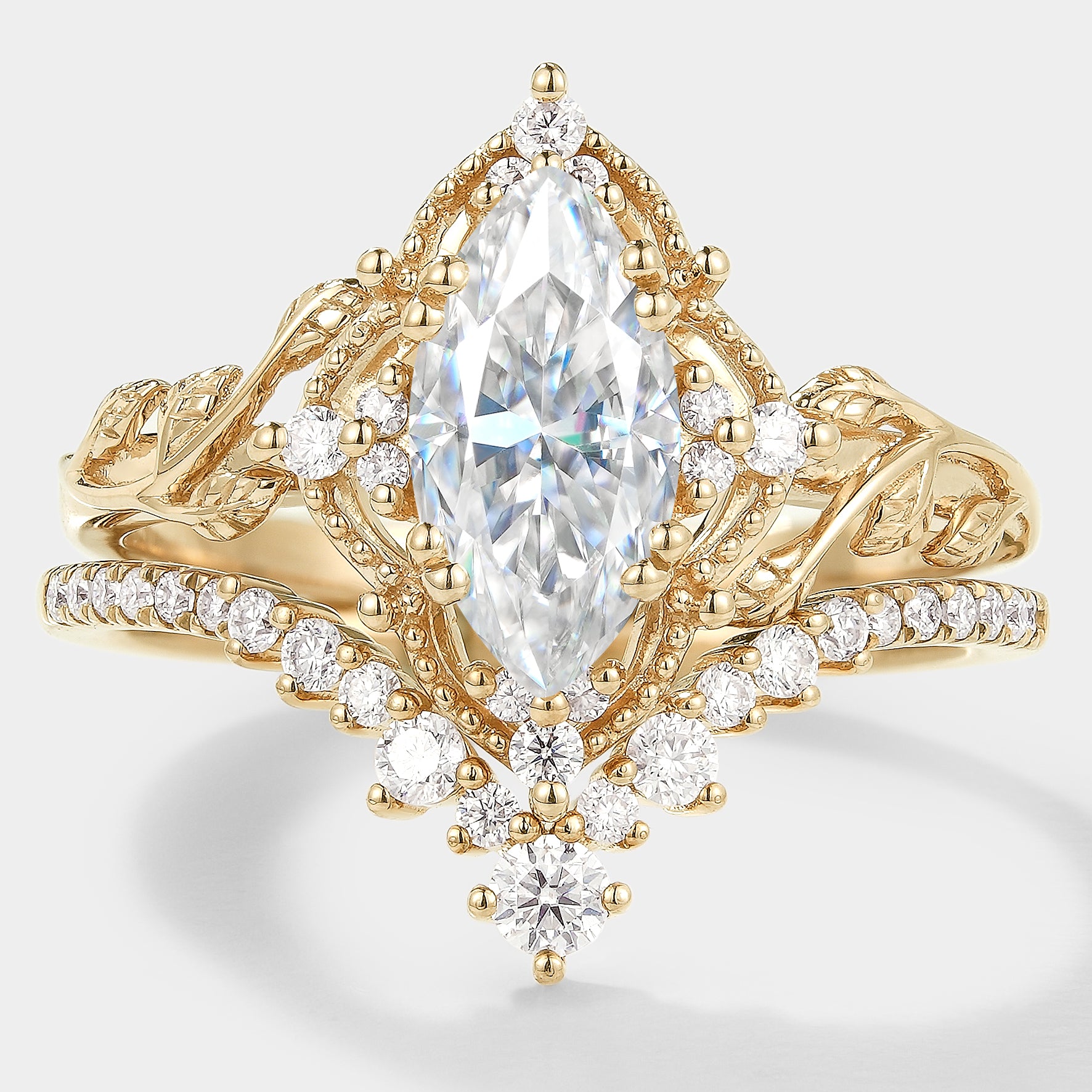 Nature-inspired marquise moissanite engagement ring set with leaf design
