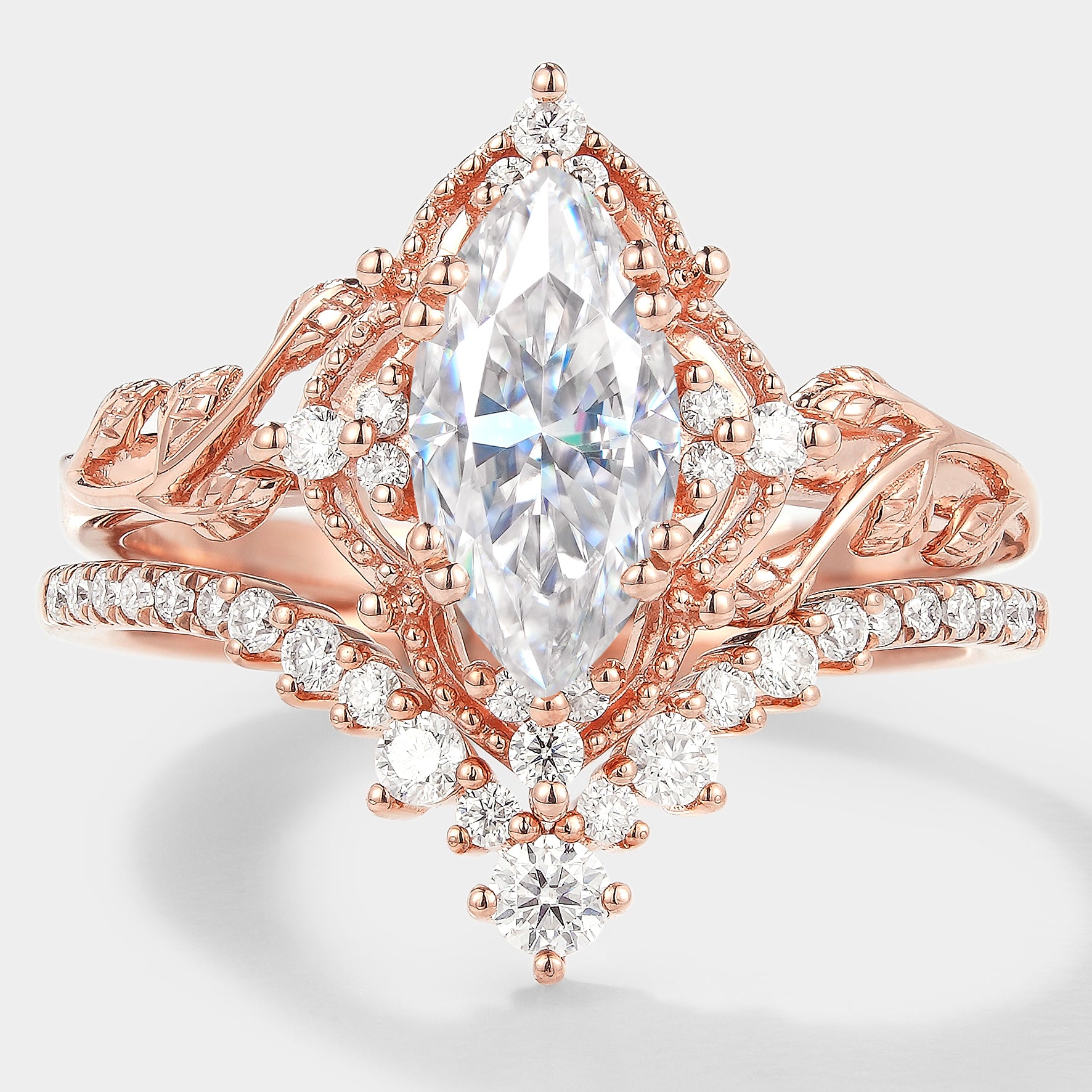 Marquise cut moissanite engagement ring with curved wedding band, rose gold