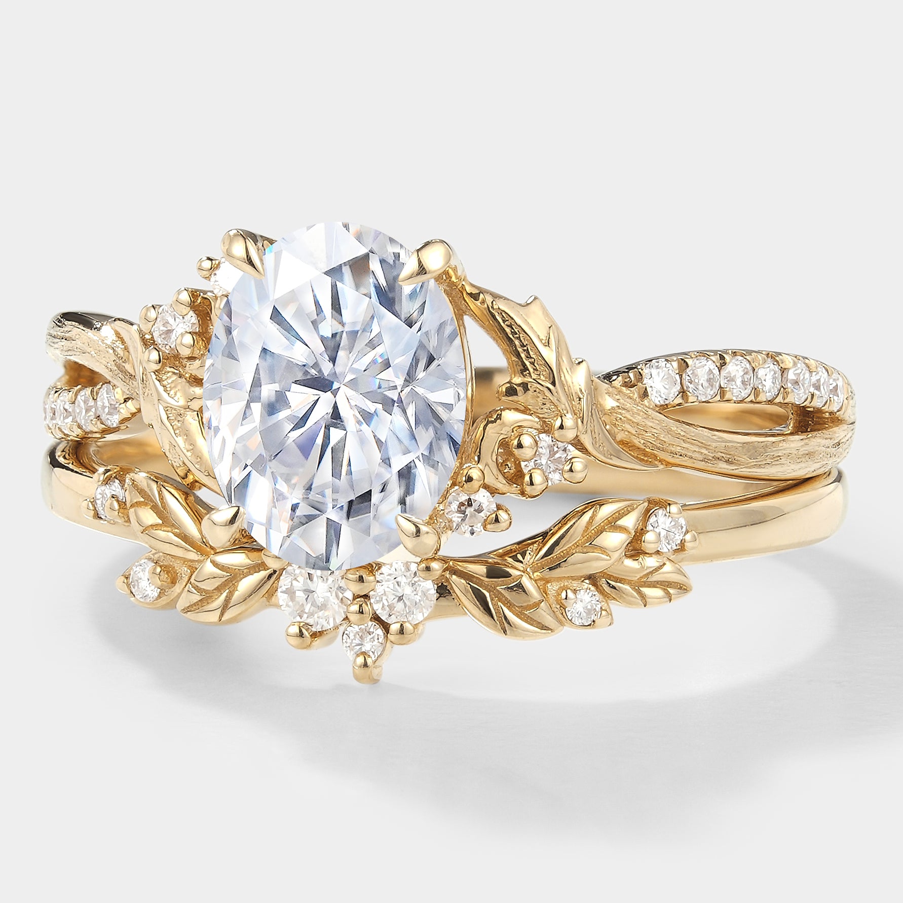 Oval moissanite engagement ring with leaf and bark texture