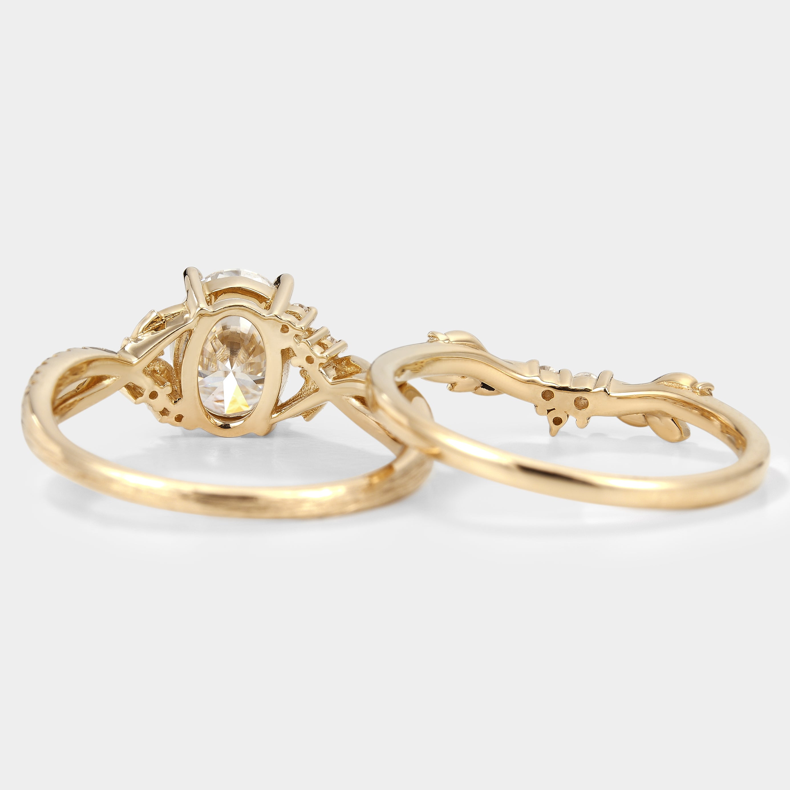 Oval moissanite engagement ring set with leaf and bark texture