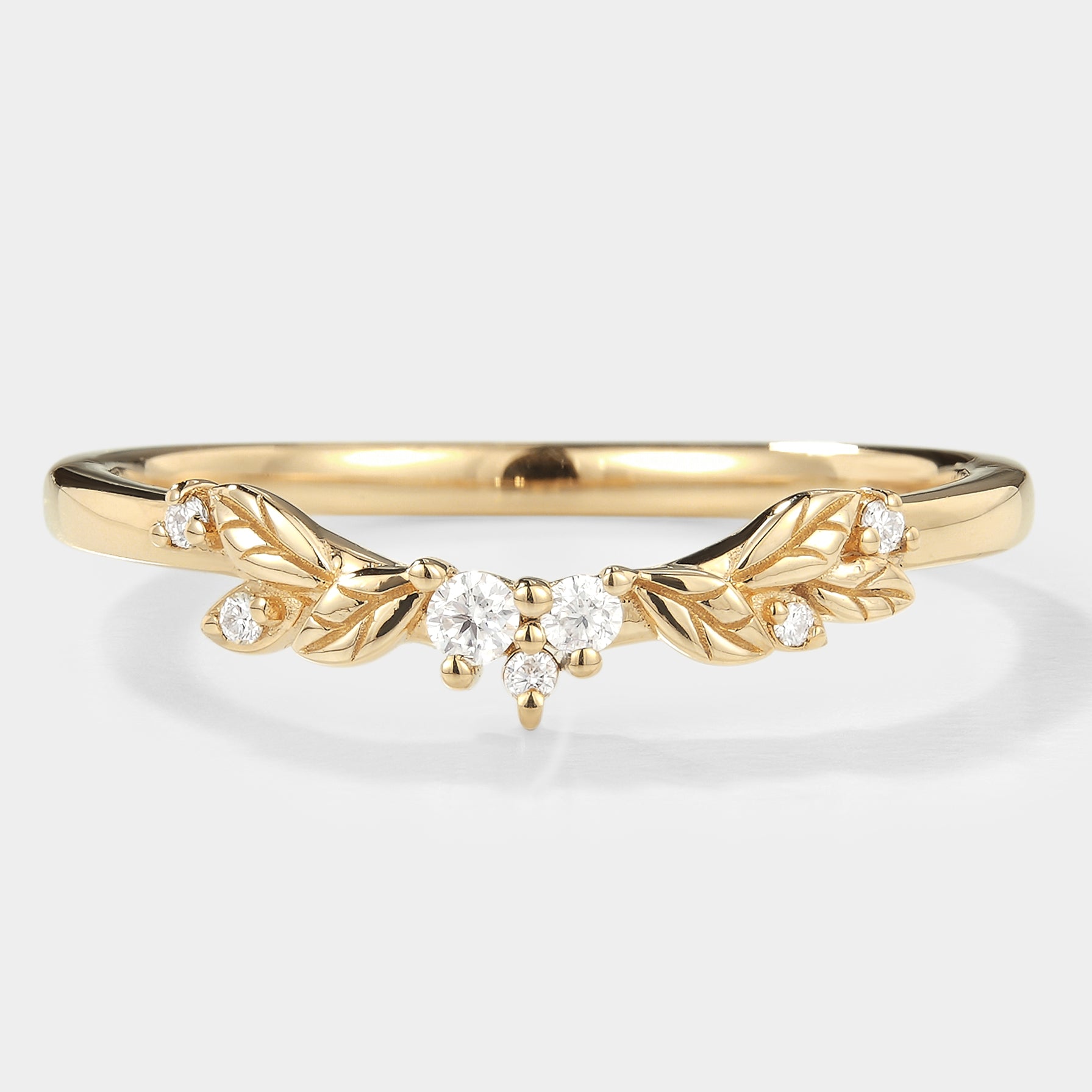 Leaf pattern wedding band with moissanite stones in gold