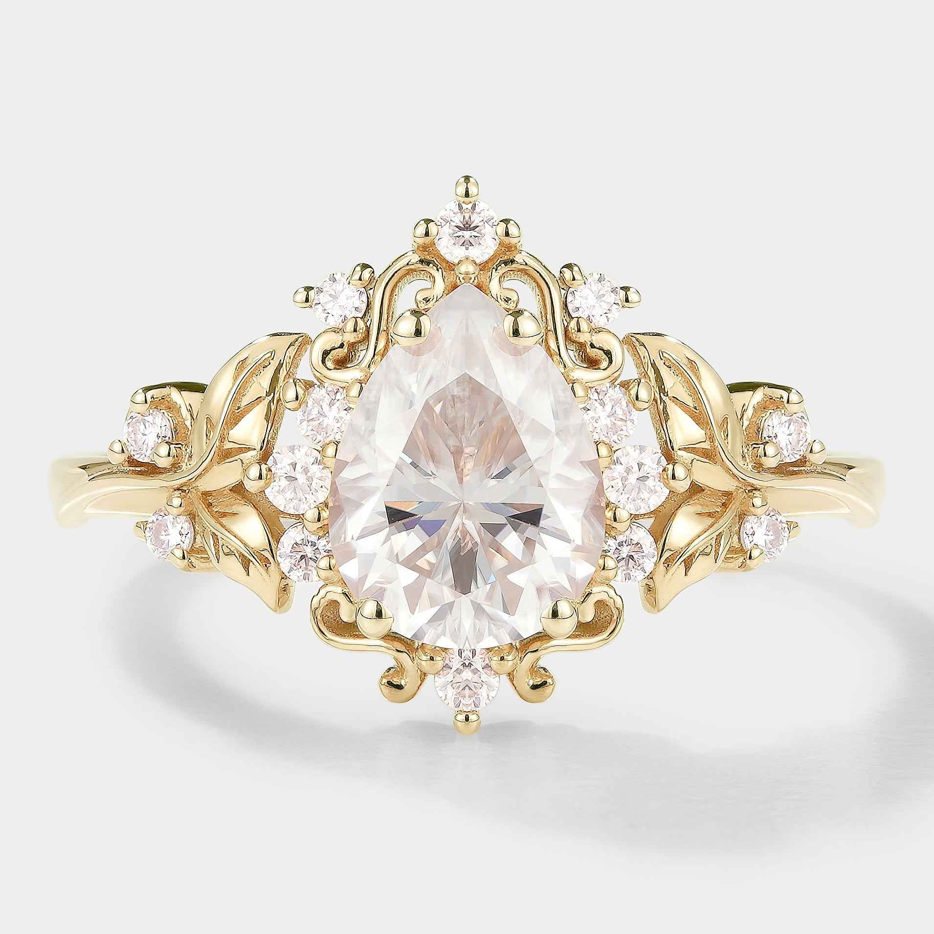 Yellow gold pear-cut moissanite engagement ring with floral details