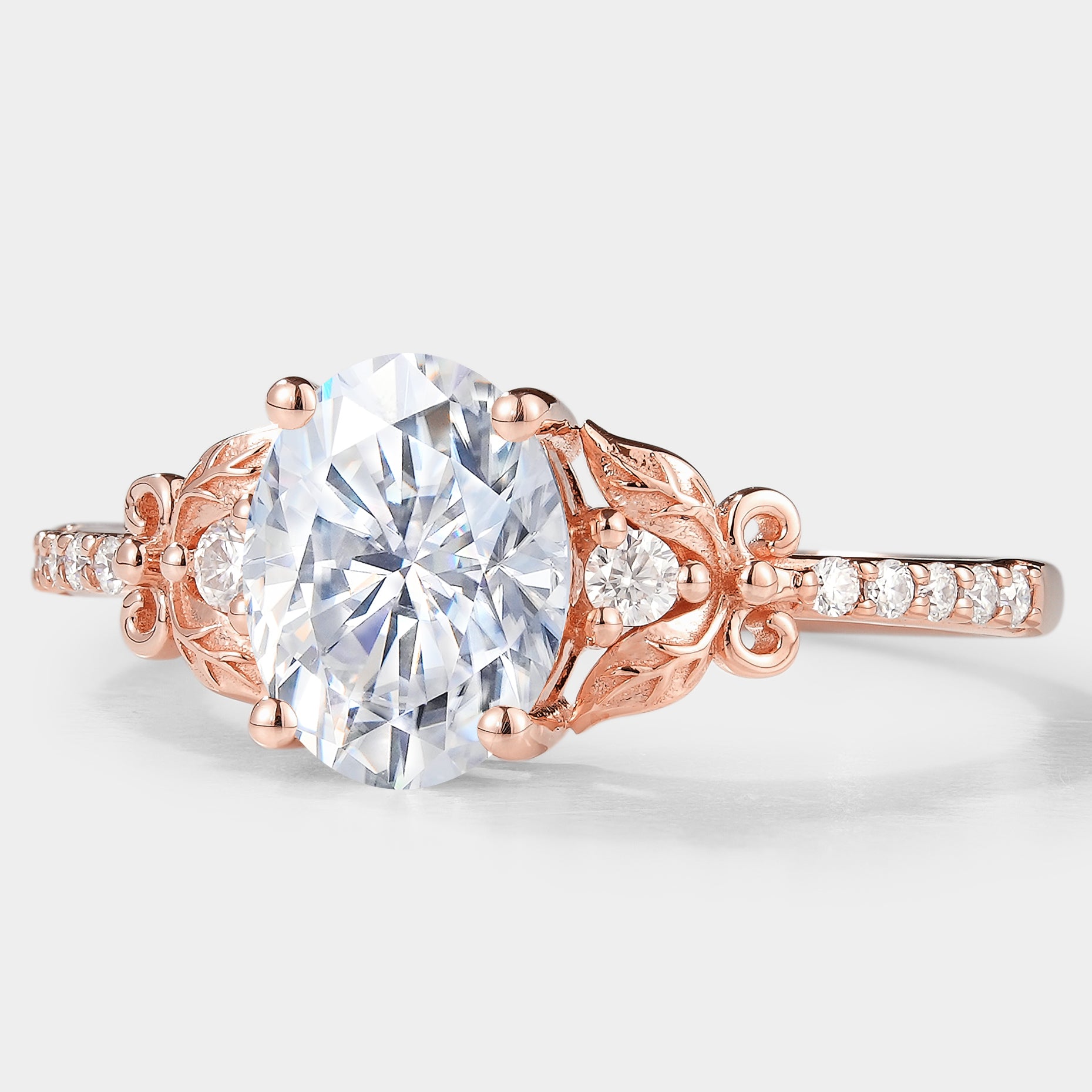 Rose gold oval moissanite leaf engagement ring