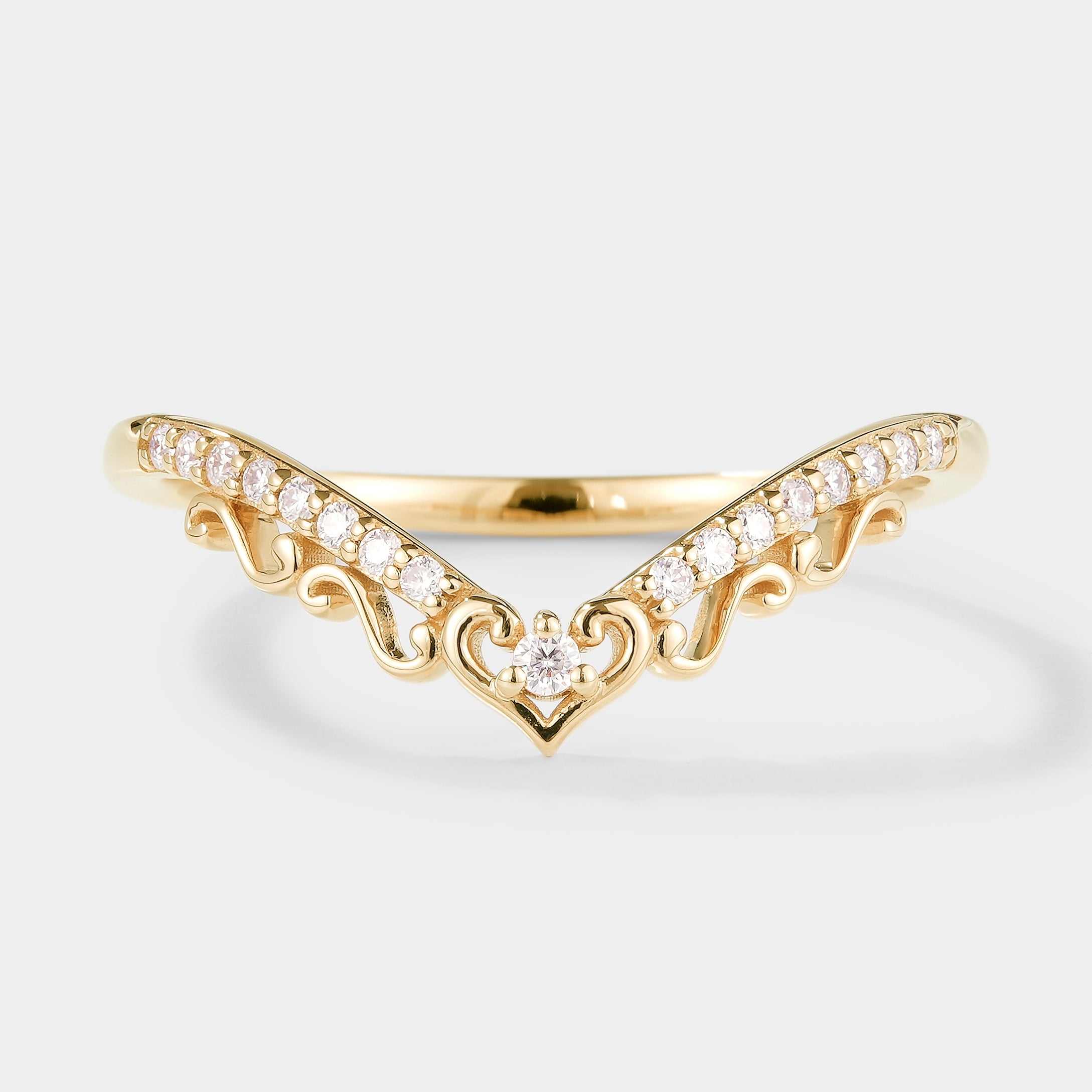 Gold chevron wedding band with heart accents and moissanite stones