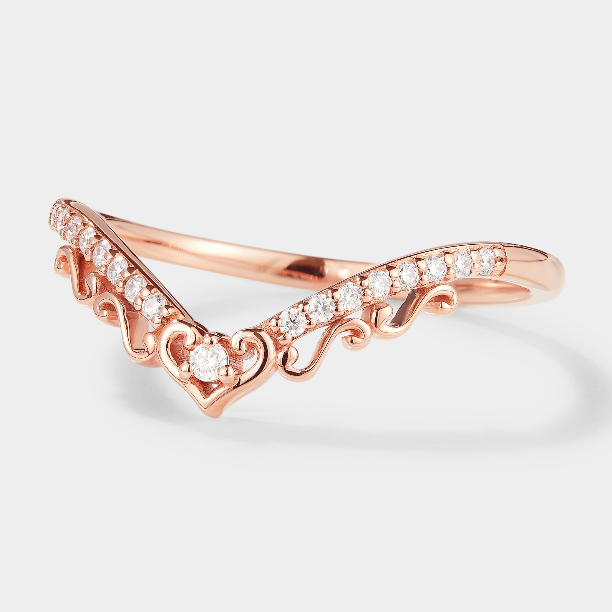 Rose gold chevron wedding band with heart design and moissanite stones