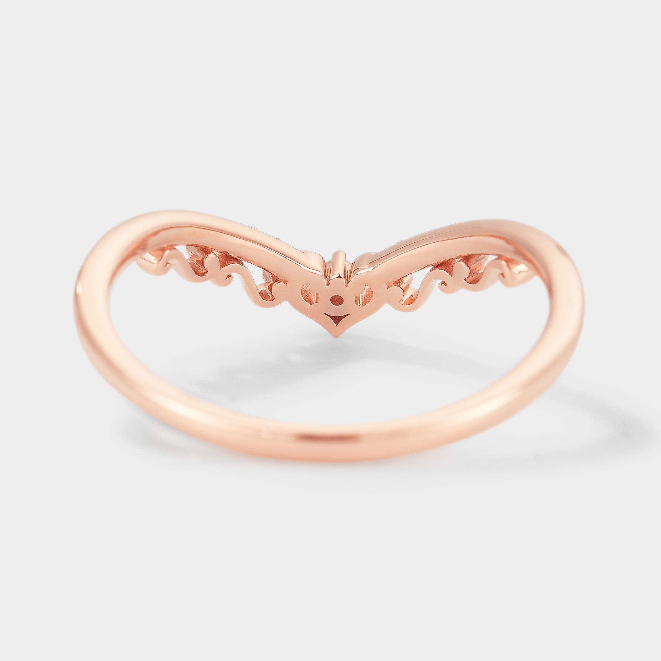 Rose gold chevron moissanite wedding band with delicate details