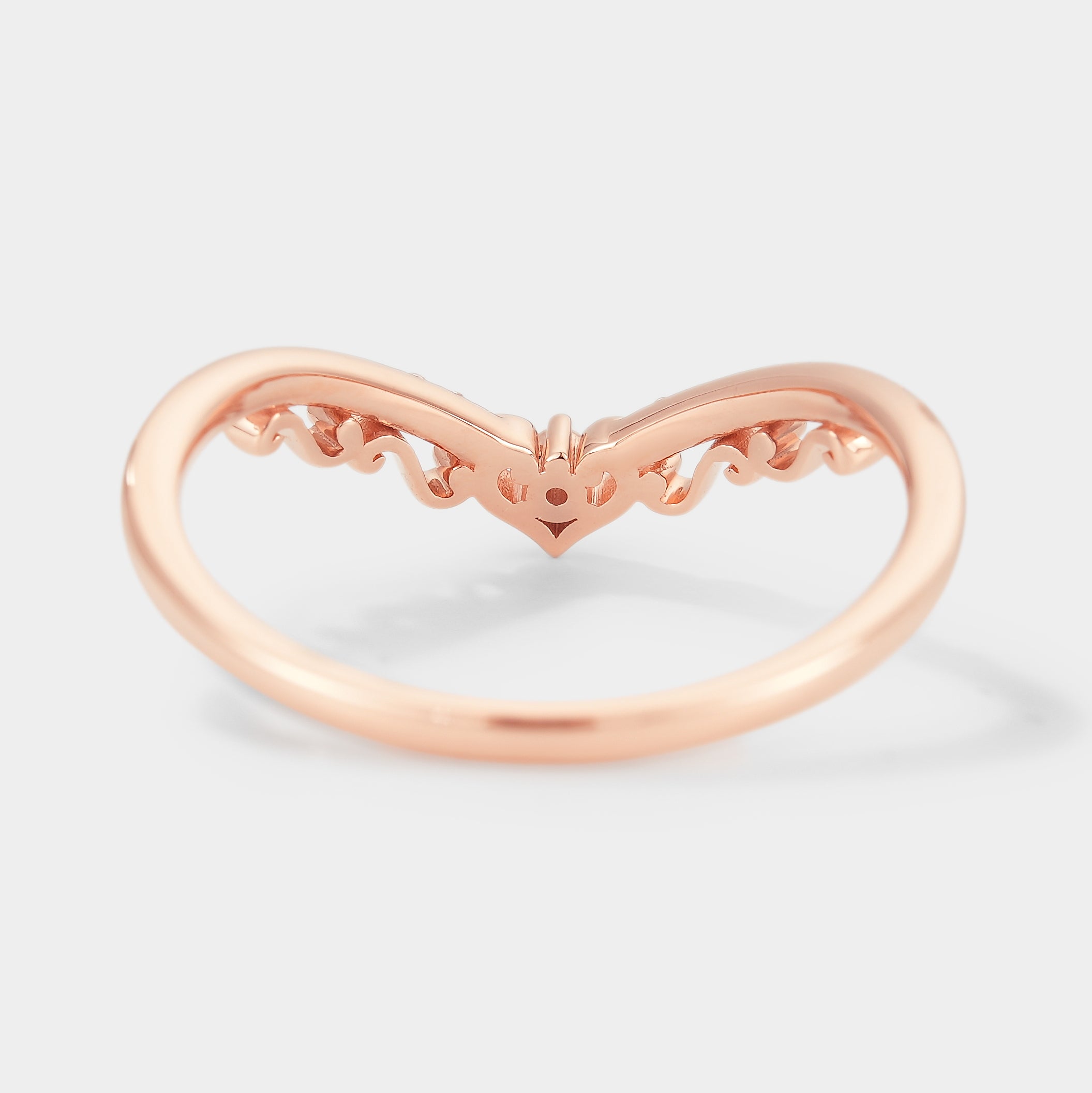 Rose gold chevron moissanite wedding band with delicate details