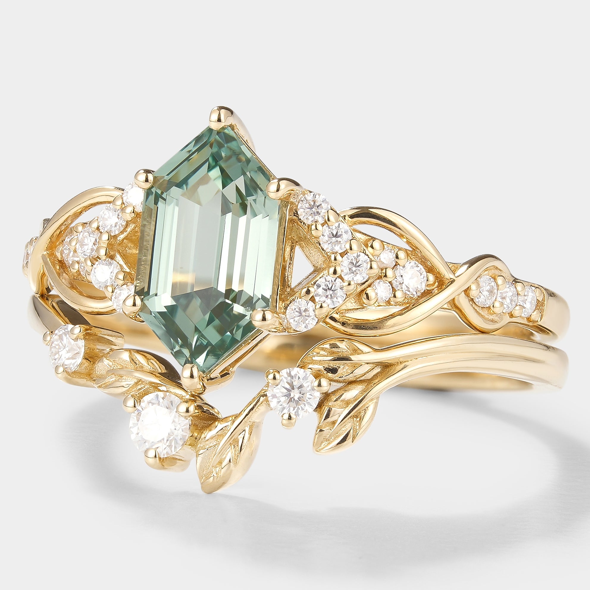 Nature-inspired green sapphire engagement ring and leaf wedding band set