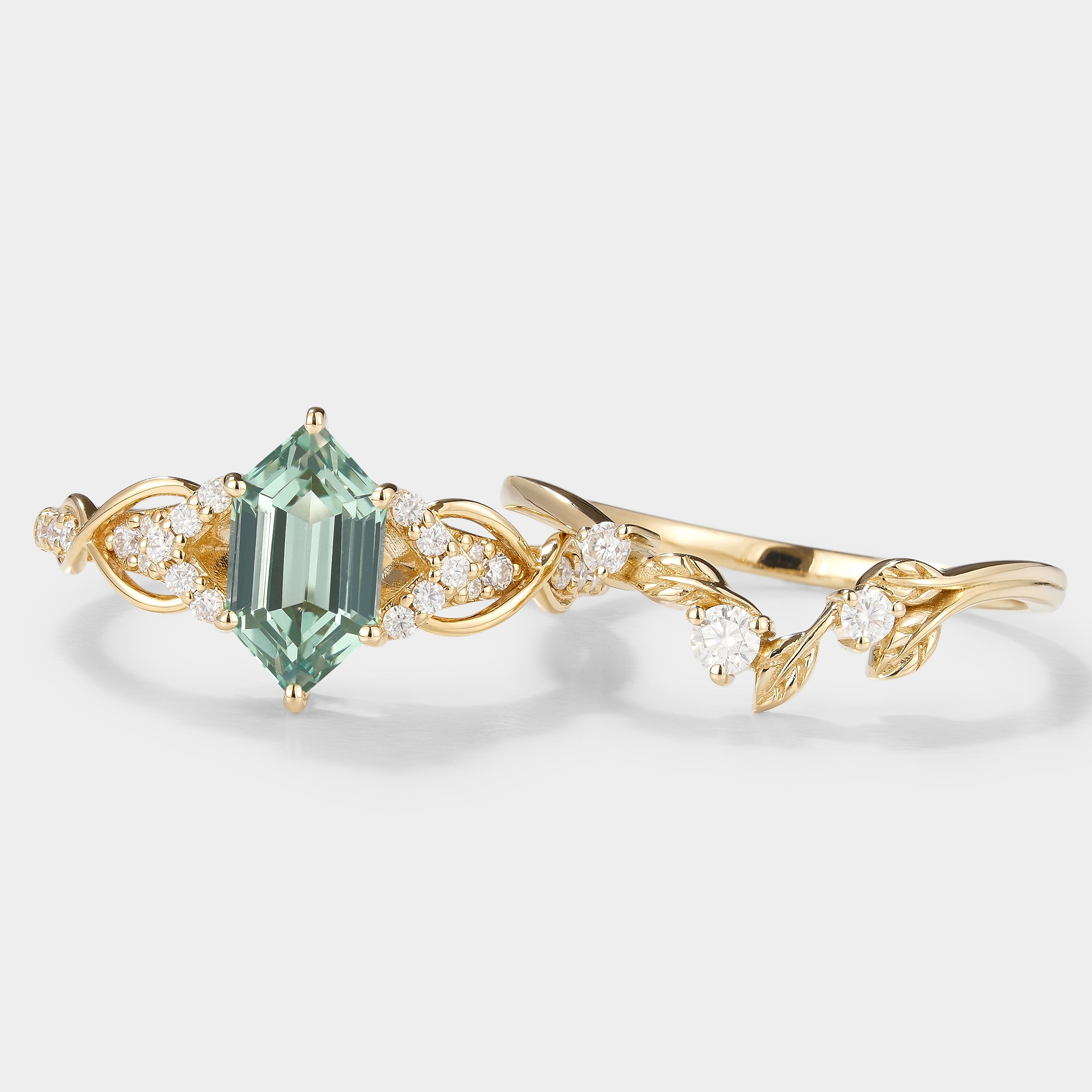 Nature-inspired green sapphire engagement ring and leaf wedding band