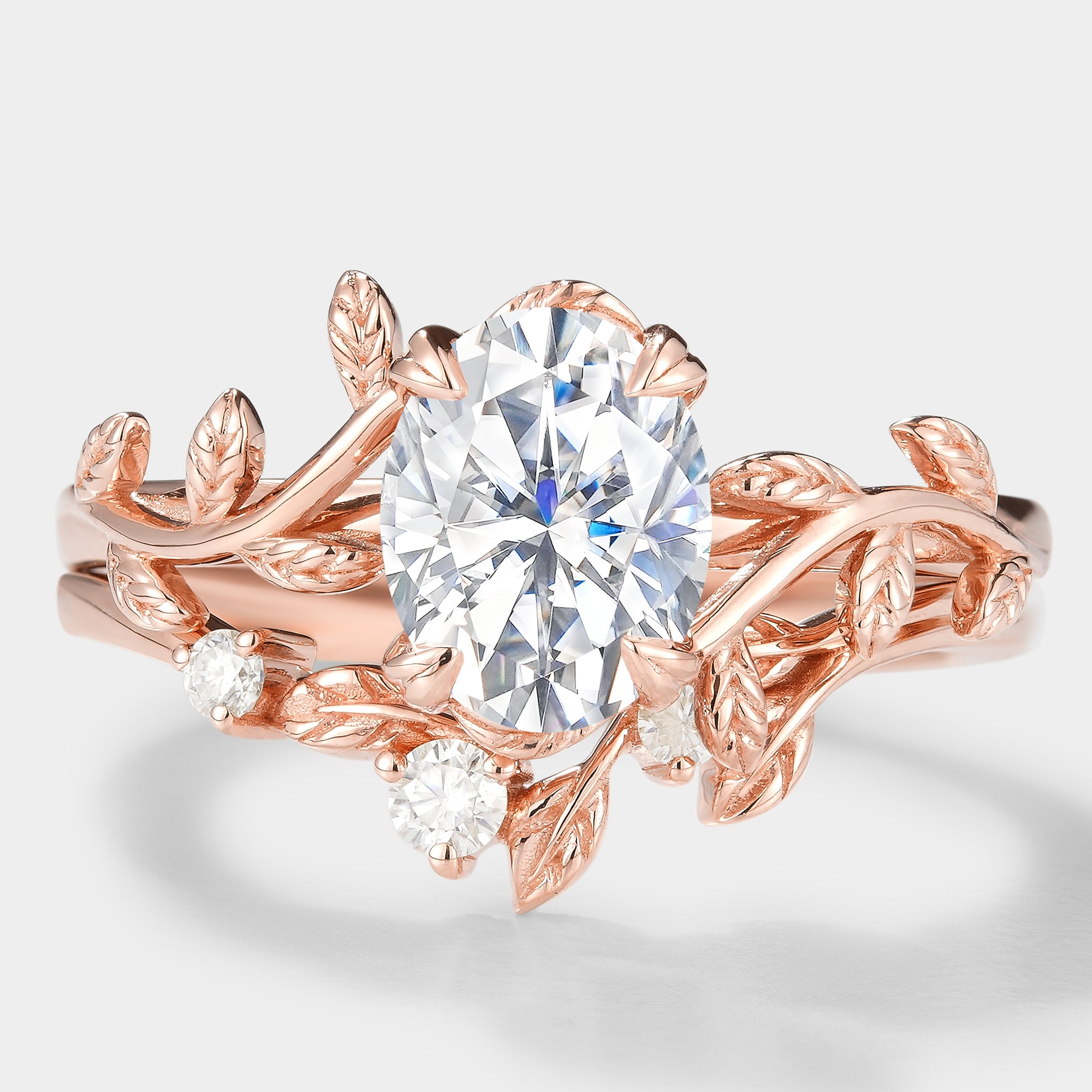 Nature-inspired oval moissanite bridal set with leaf design