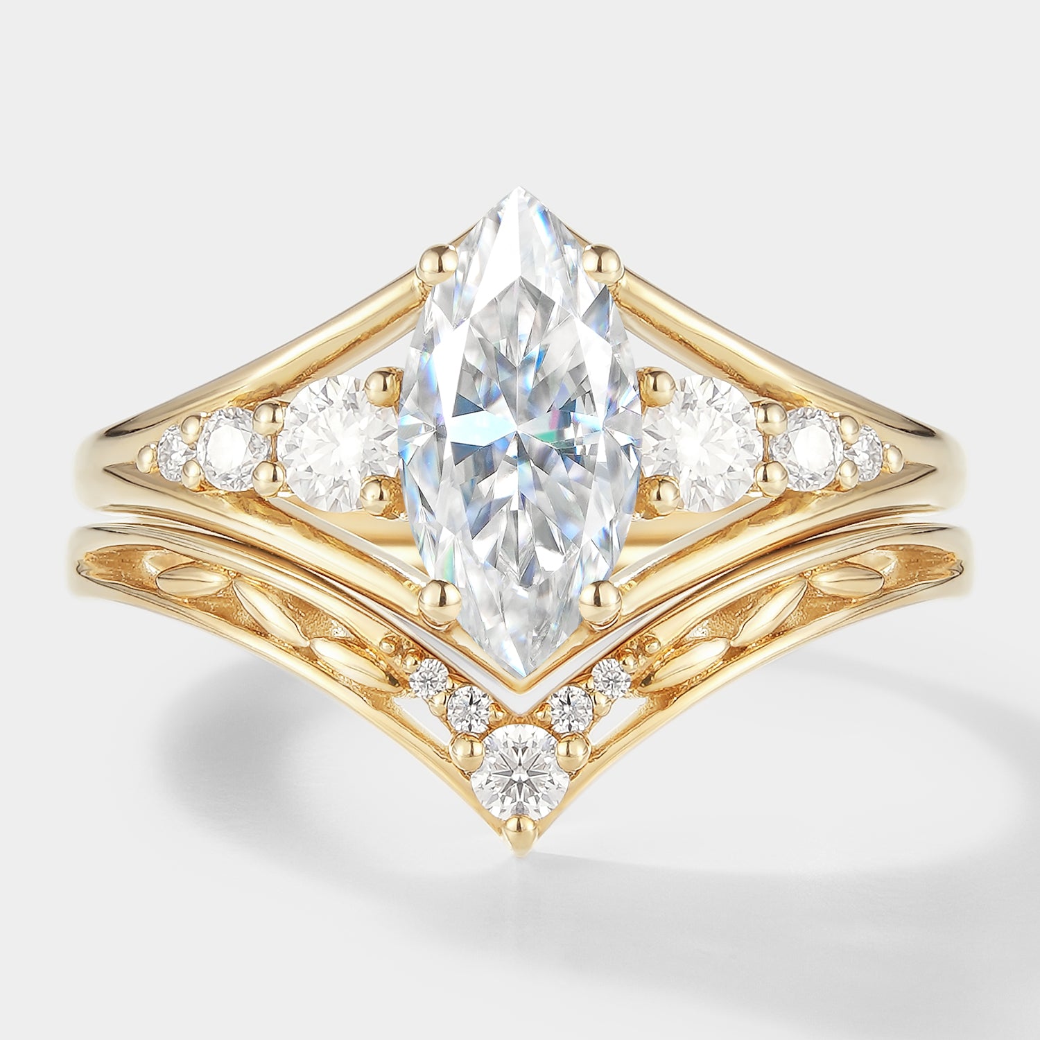 Marquise moissanite engagement ring with chevron wedding band in yellow gold, bridal set