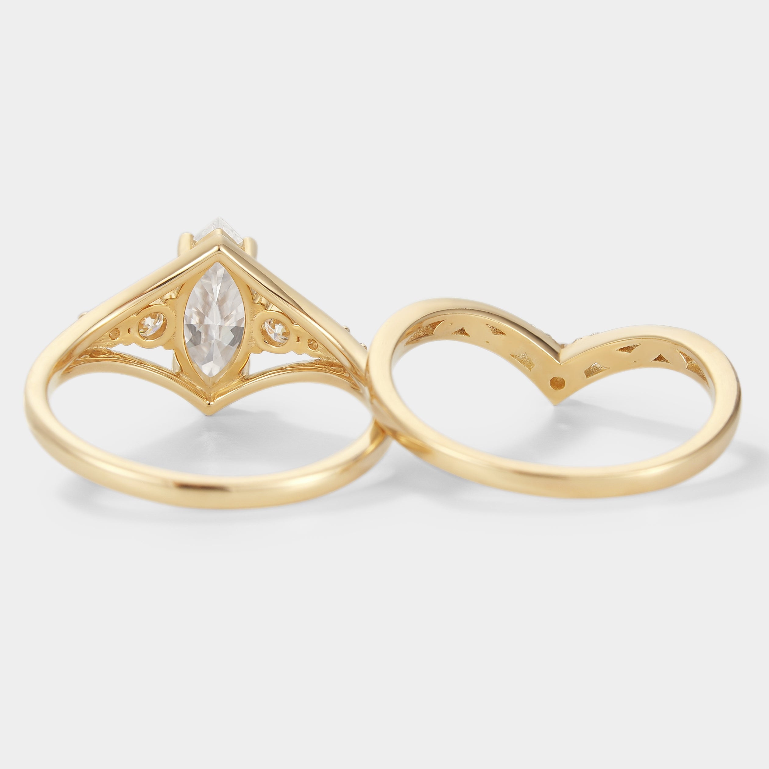 Marquise moissanite engagement ring with chevron wedding band in yellow gold. Bridal set.