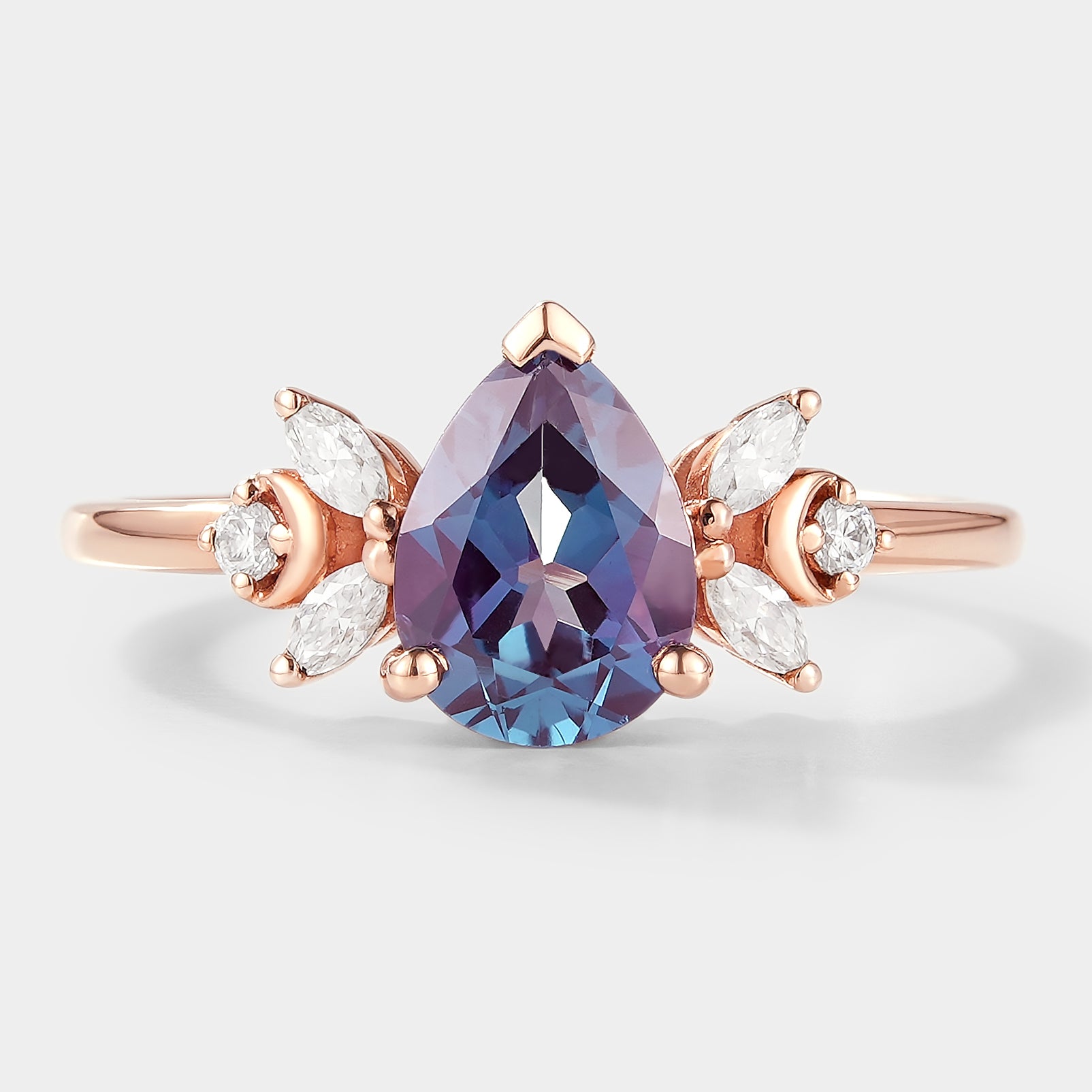 Pear cut alexandrite engagement ring with moissanite cluster, rose gold band, bridal set