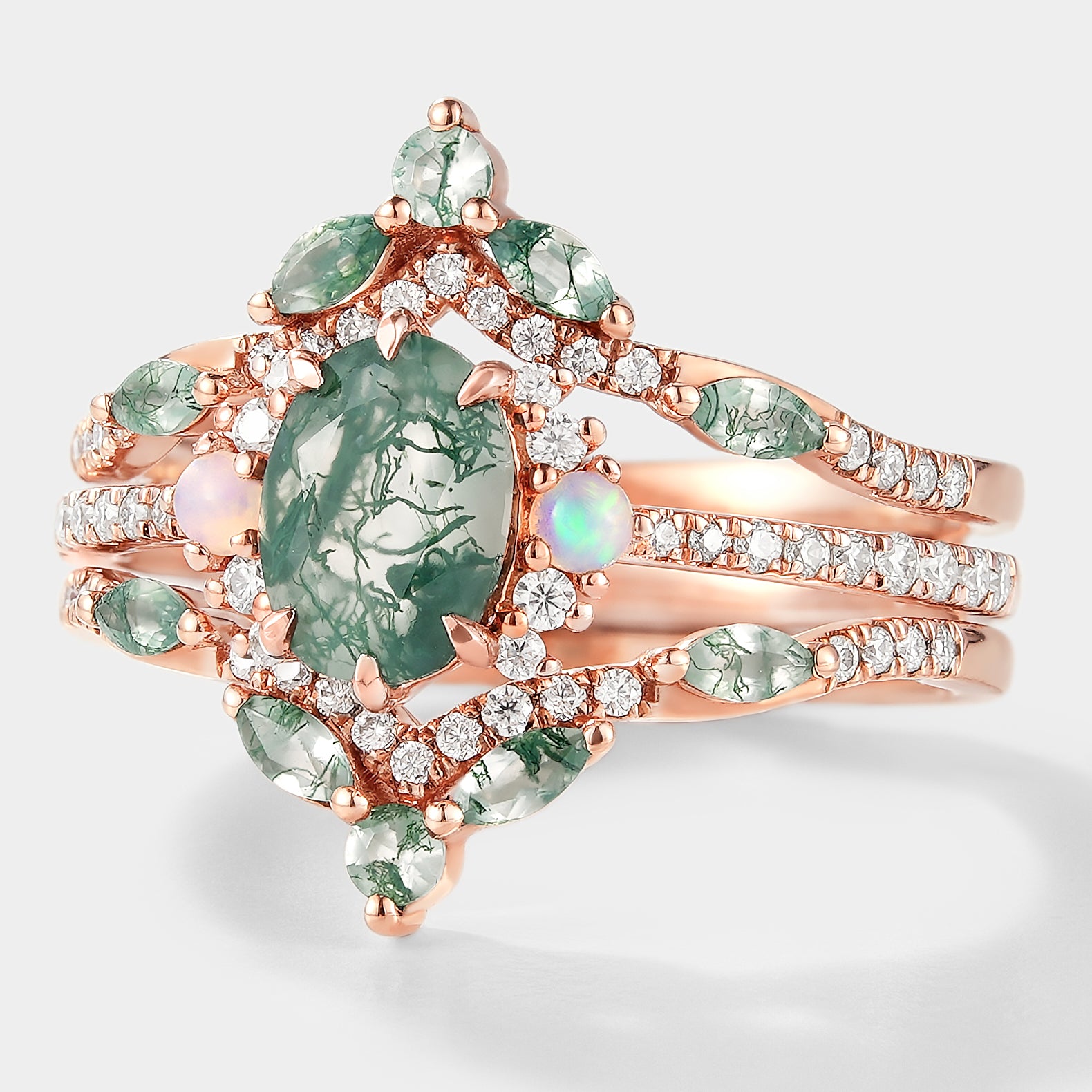 Rose gold moss agate engagement ring with enhancer wedding band, featuring opal and moissanite accents, bridal set.