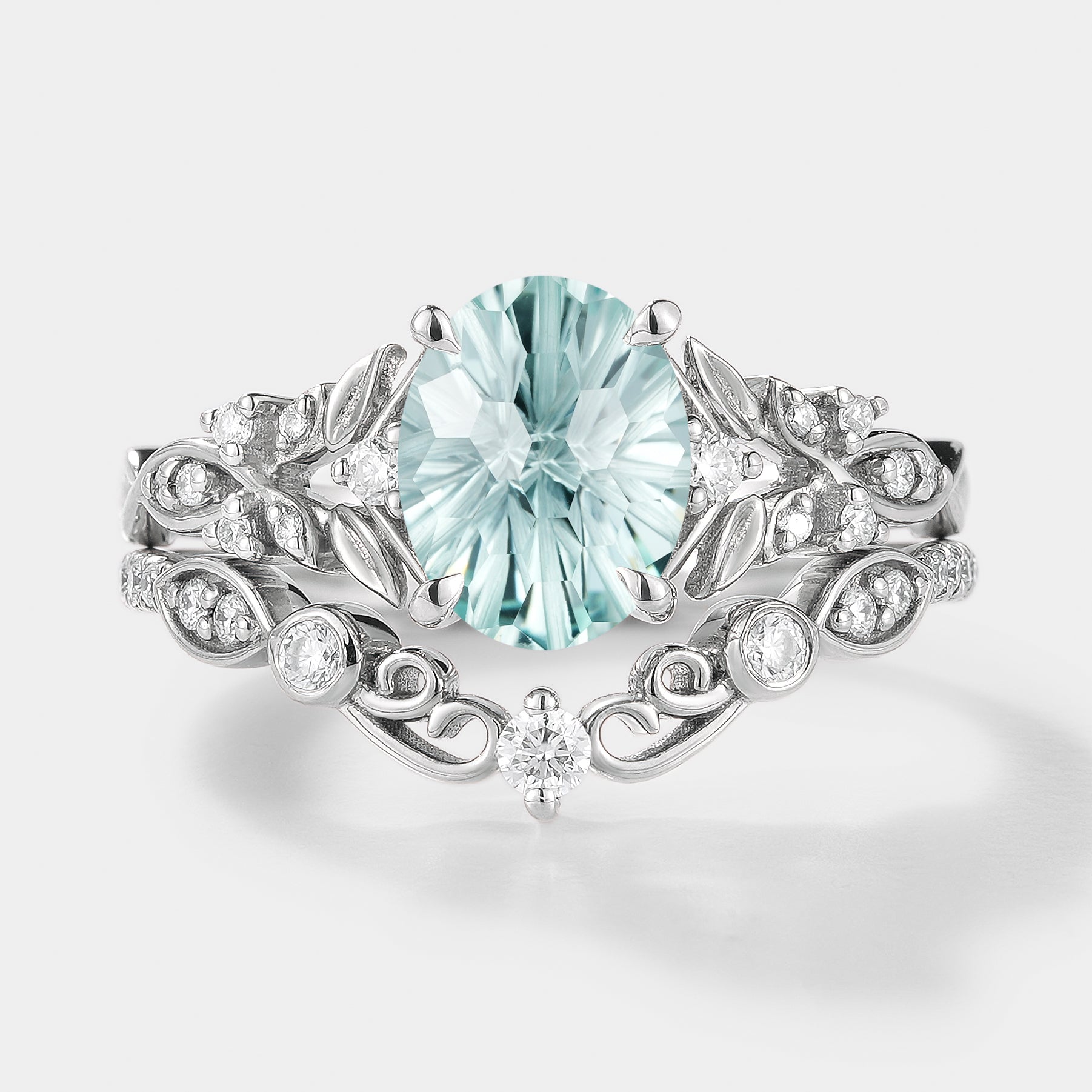 Aquamarine engagement ring set with leaf and moissanite accents