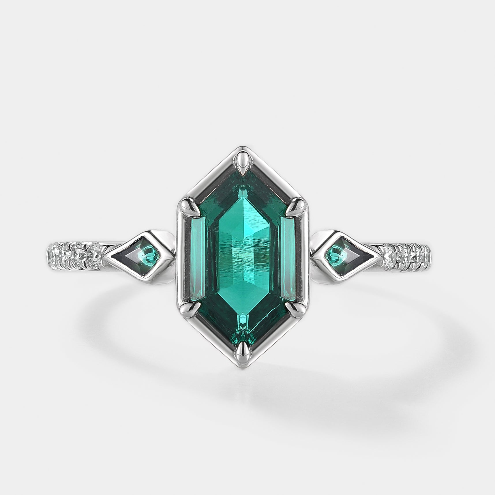 Hexagon cut lab emerald engagement ring with kite cut accent stones