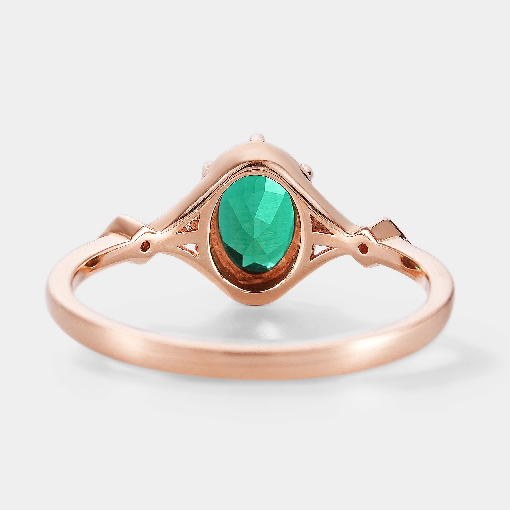 Rose gold emerald engagement ring, nature inspired design, oval cut emerald.