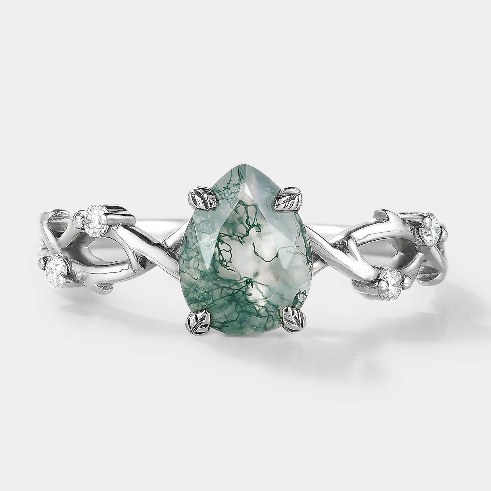 Pear cut moss agate engagement ring with leaf and vine design