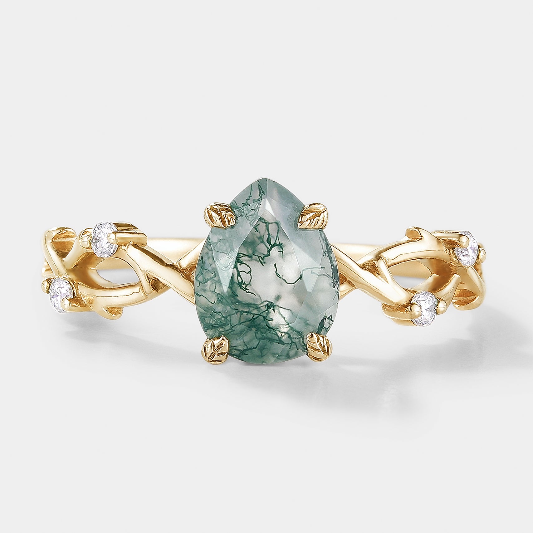Pear cut moss agate ring with leaf design