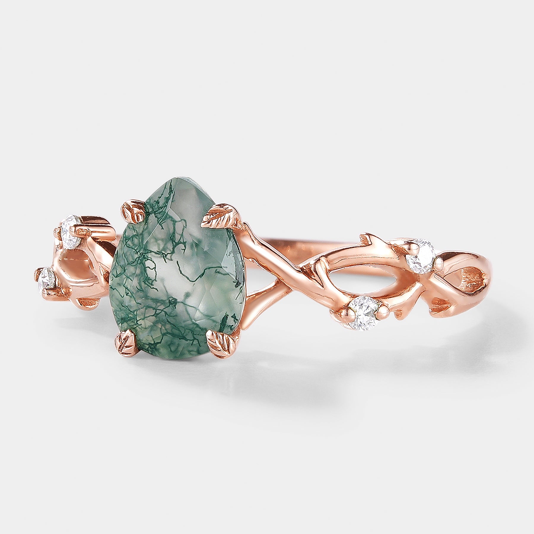 Nature-inspired moss agate engagement ring with vine leaf design