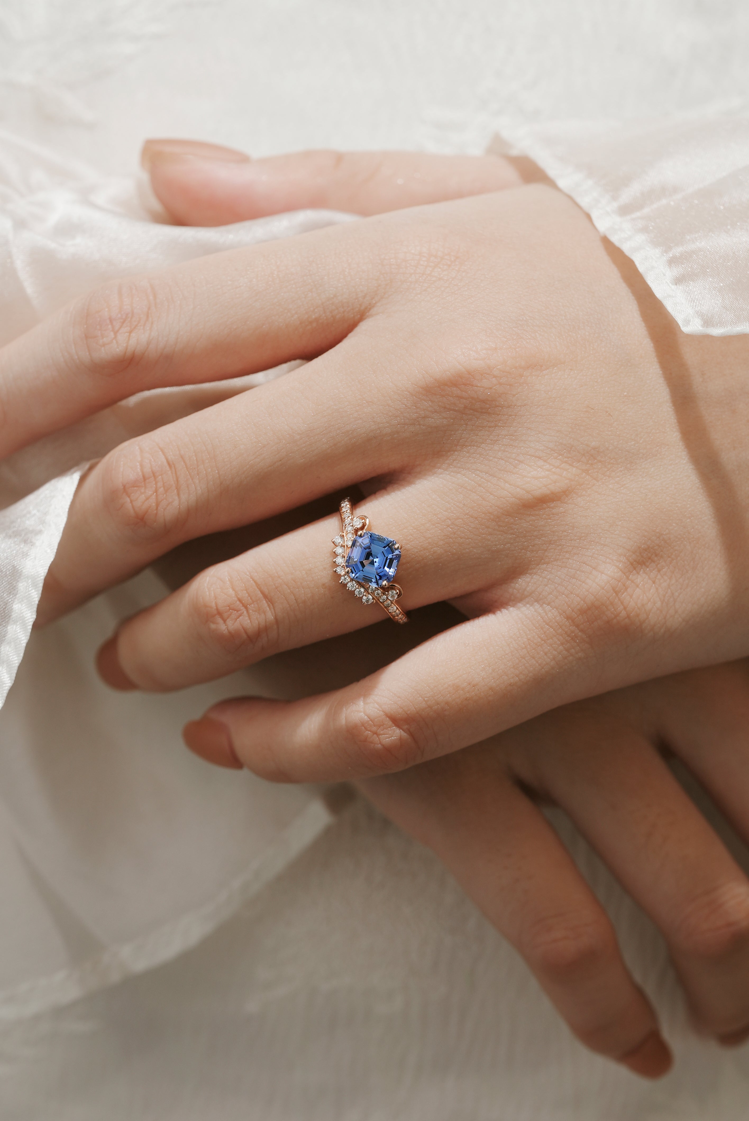 Rose gold engagement ring with cushion-cut cornflower sapphire