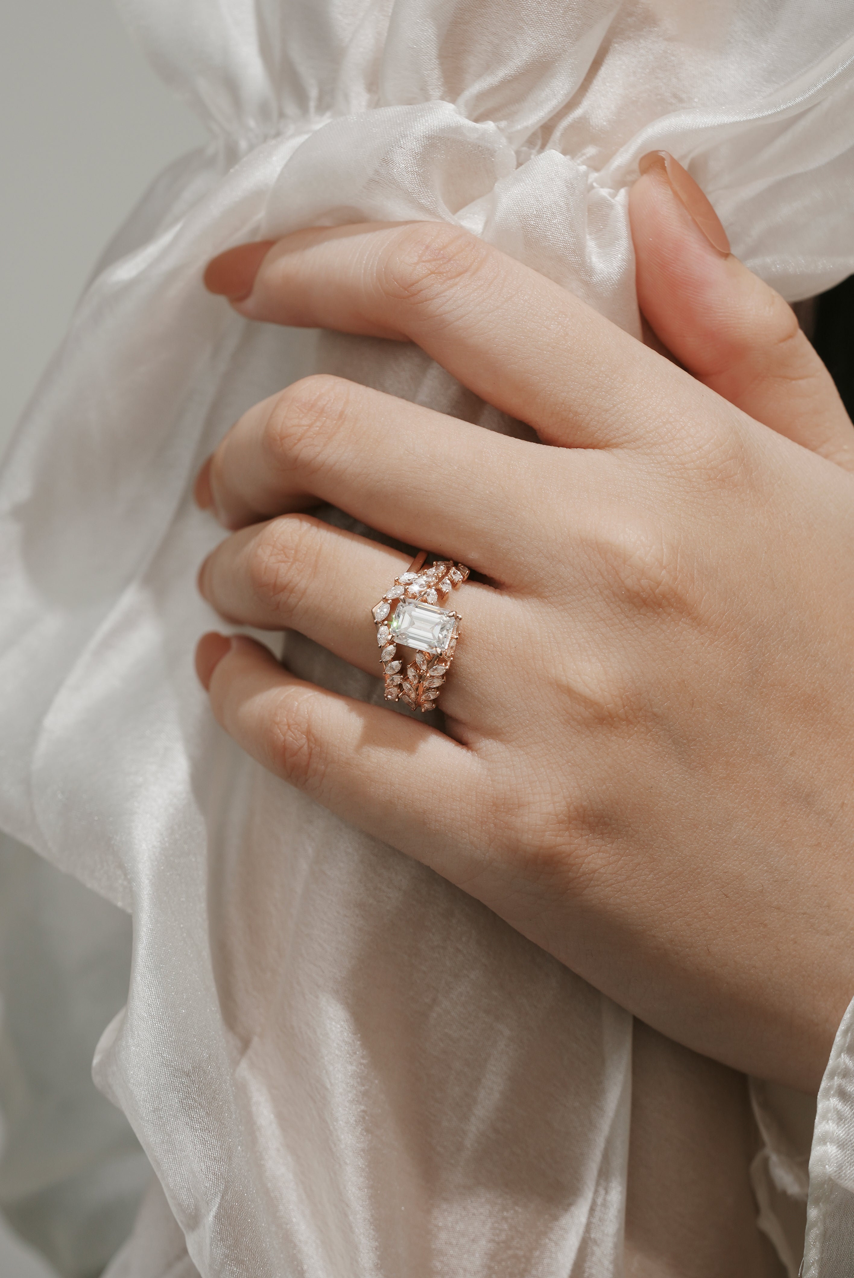 Rose gold leaf moissanite ring set on hand, bridal jewelry