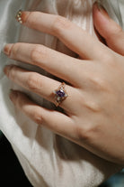 Alexandrite leaf engagement ring on a hand