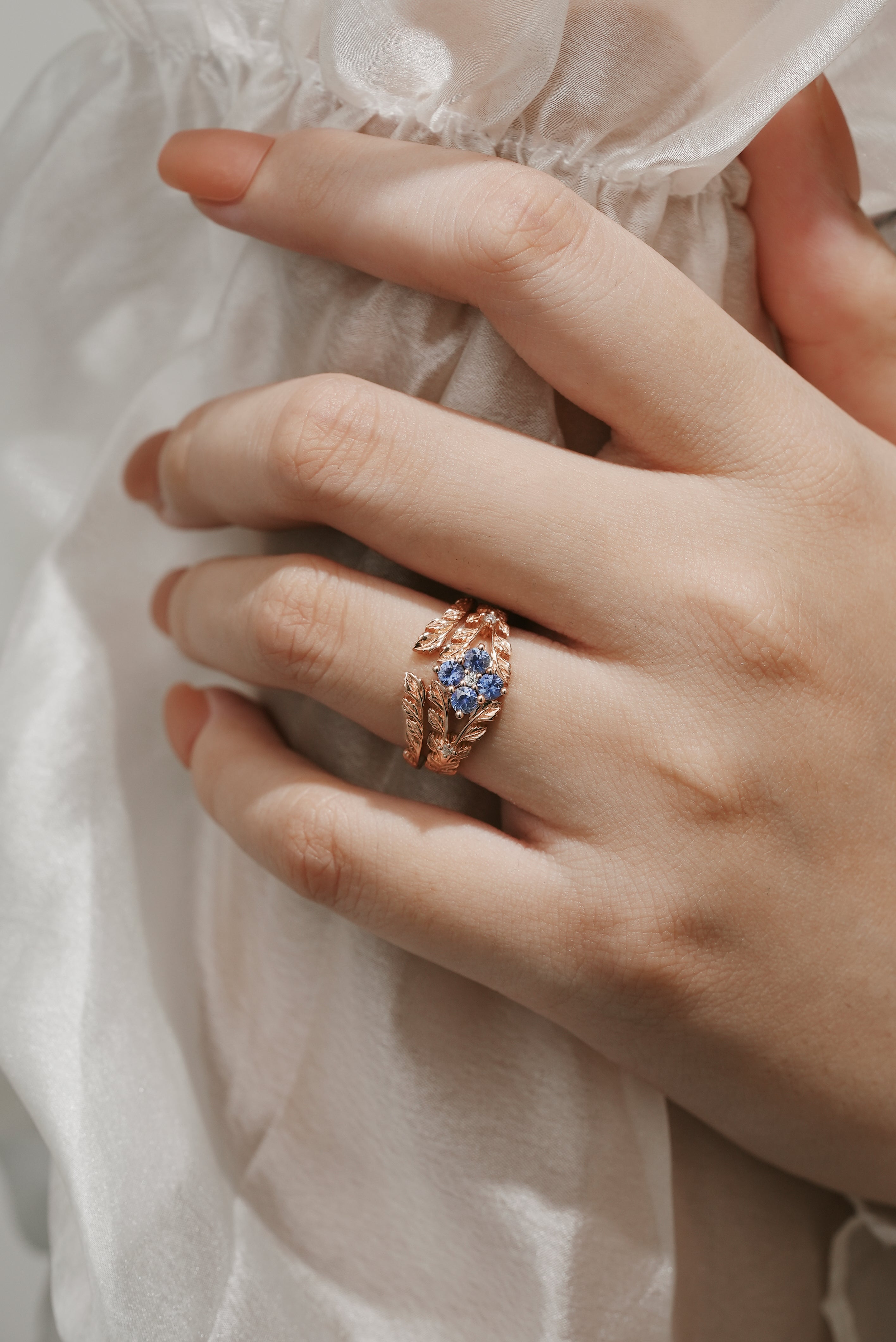 Leaf-Inspired Cornflower Sapphire Engagement Ring Set on Hand