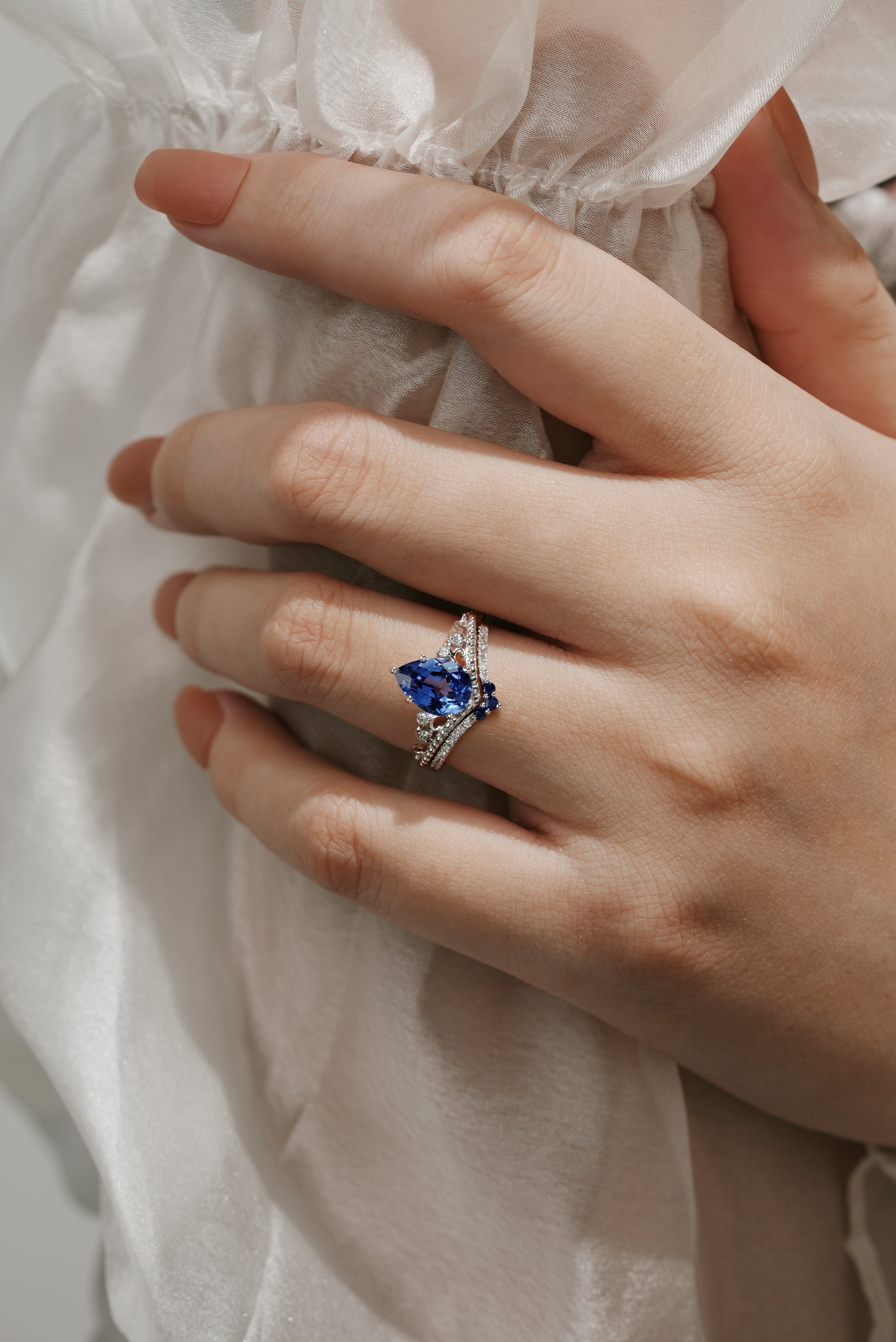 Hand wearing Vintage Cornflower Sapphire Engagement Ring Set