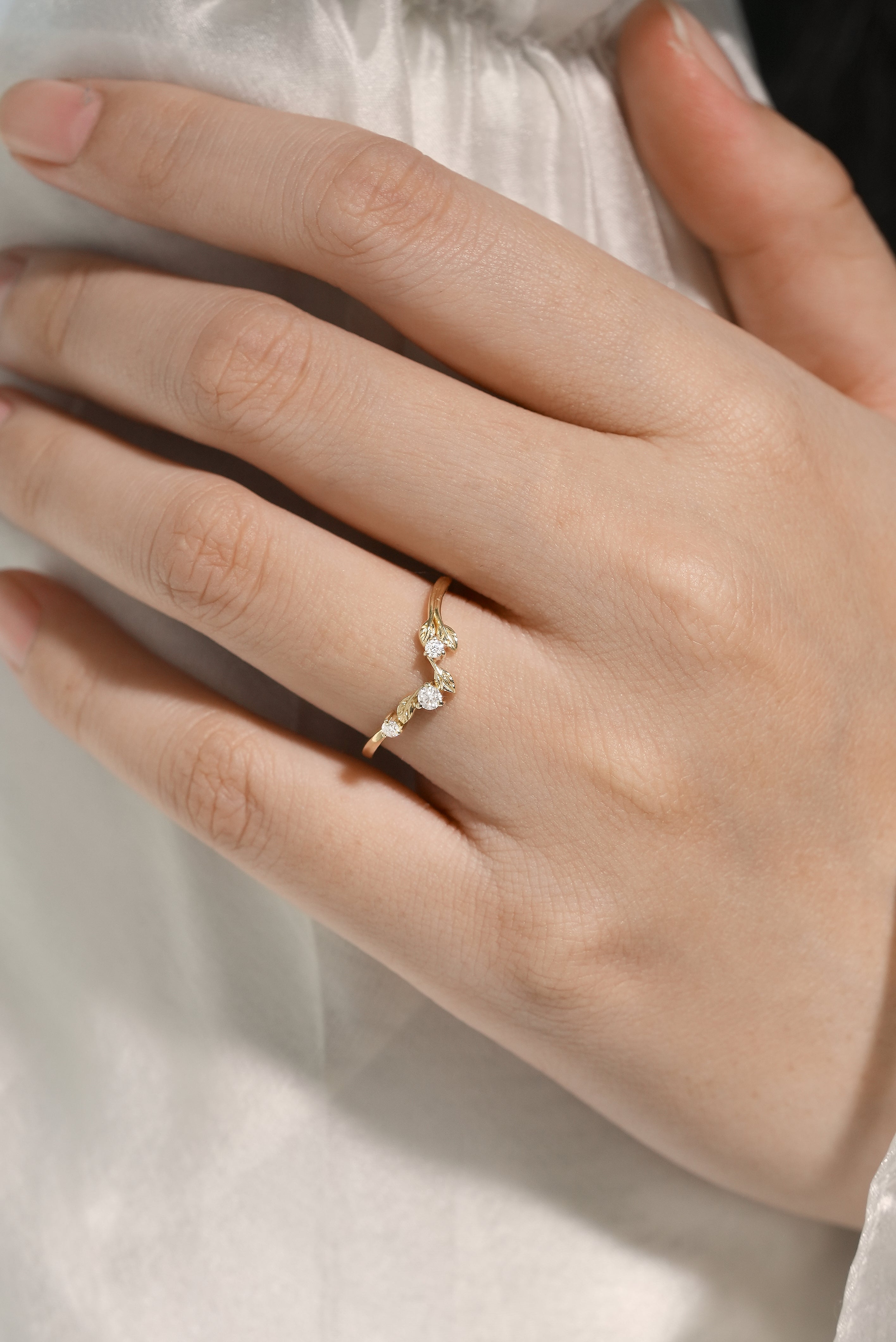 Yellow gold leaf design wedding band with moissanite stones