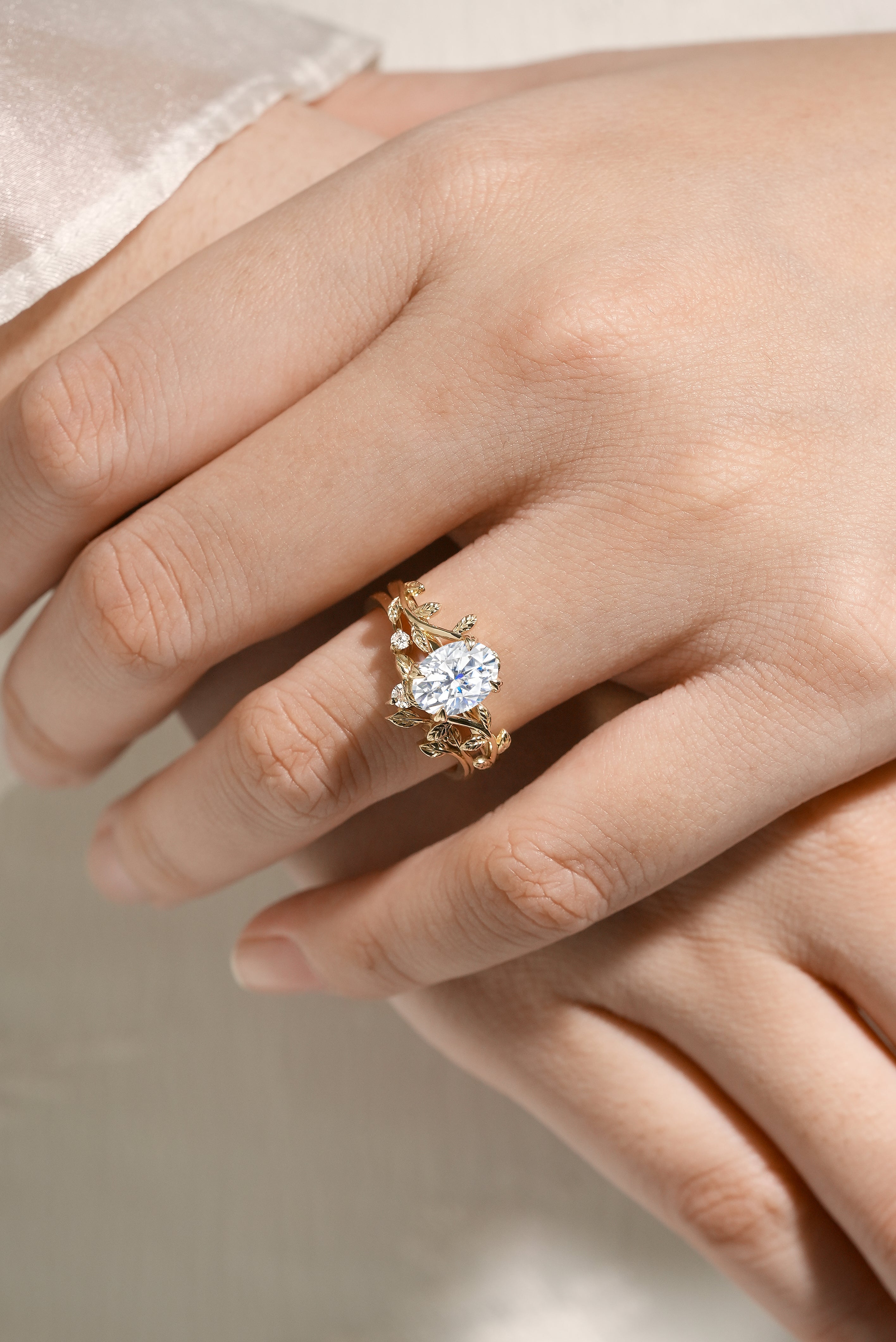 Nature-inspired oval moissanite engagement ring in gold