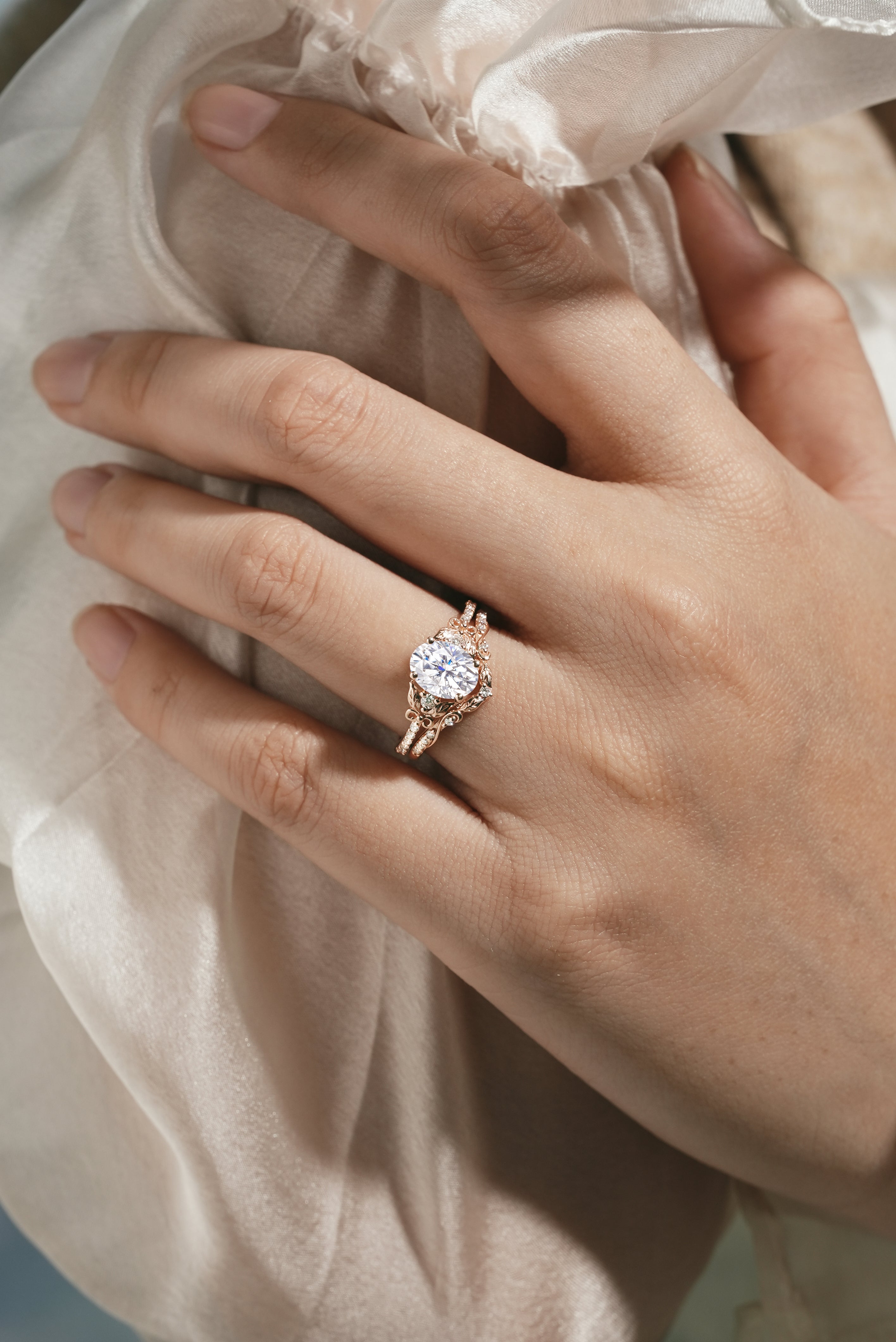 Rose gold leaf-inspired moissanite ring set on hand