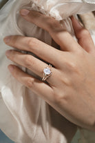 Rose gold leaf-inspired moissanite ring set on hand