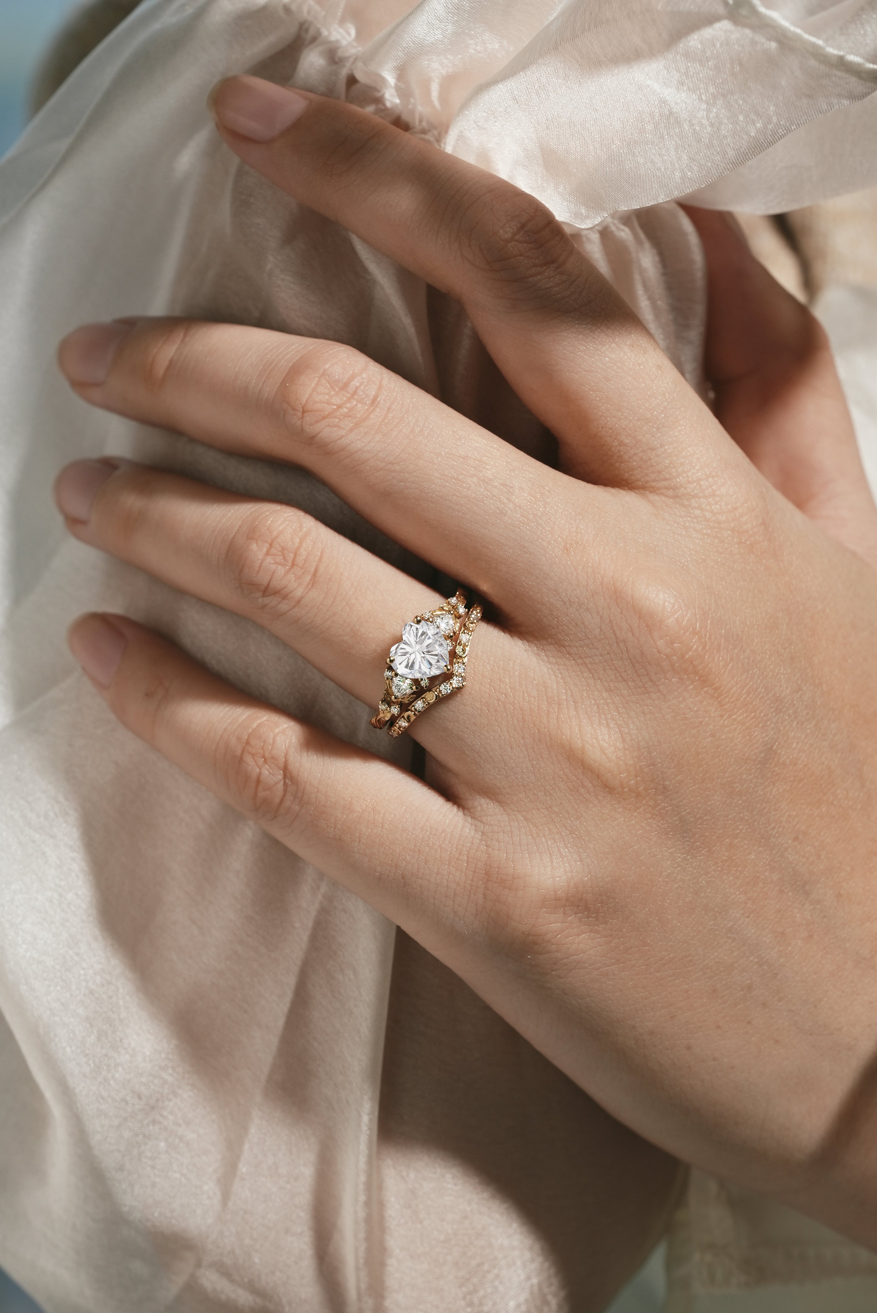 Heart-cut moissanite engagement ring and moon wedding band